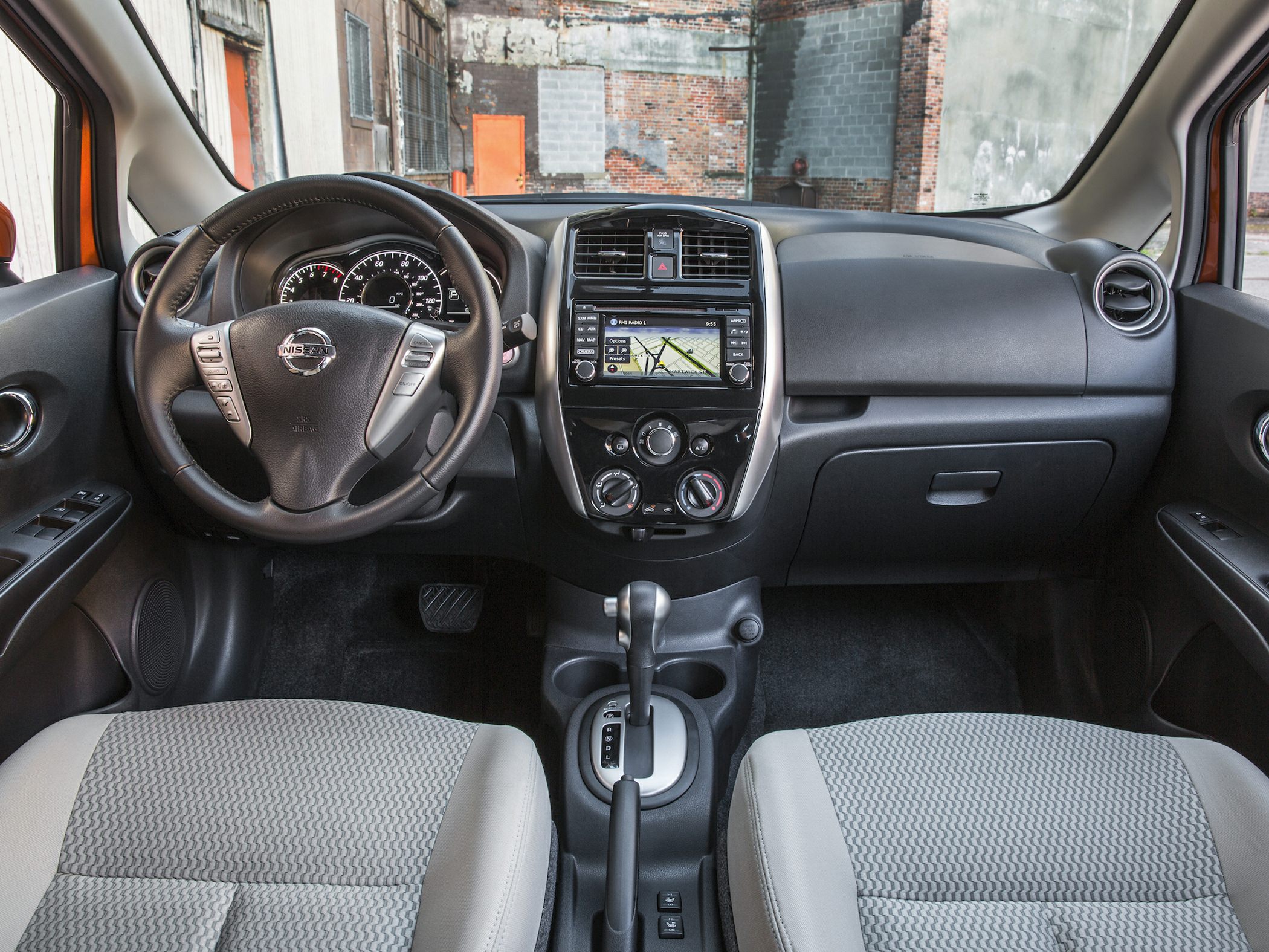 Dashboard, steering wheel, and center console with multimedia display