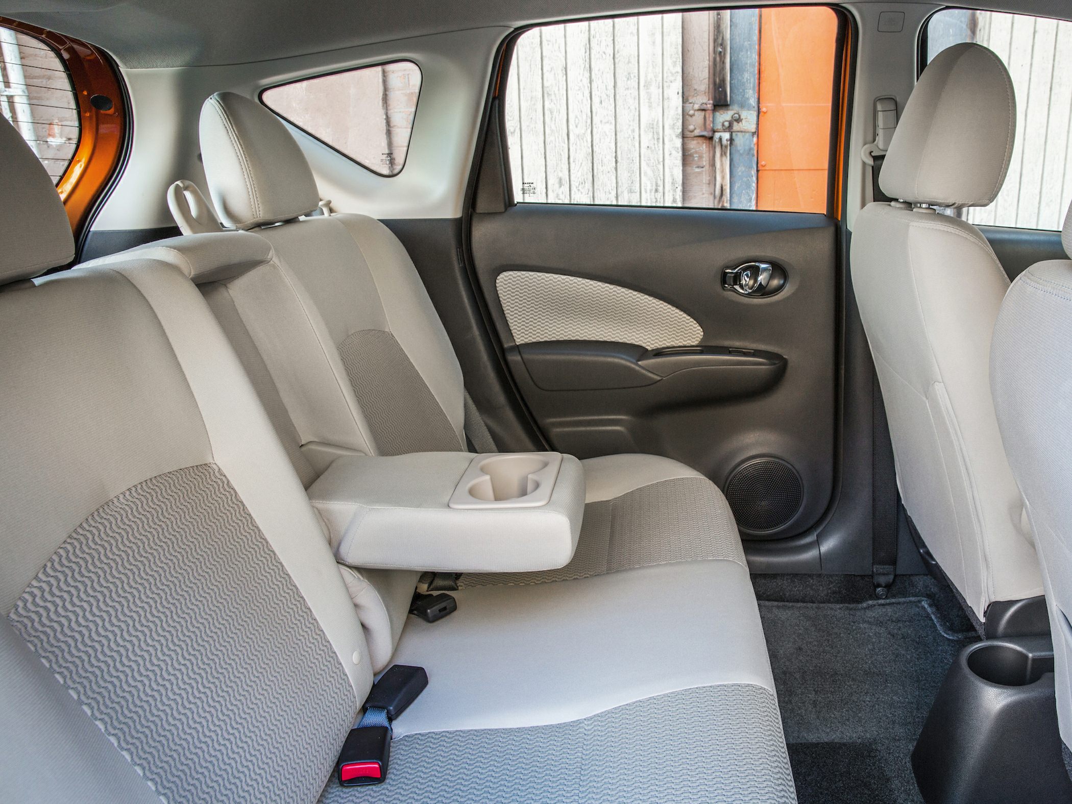 Rear fabric seats with fold-down armrest and cup holders