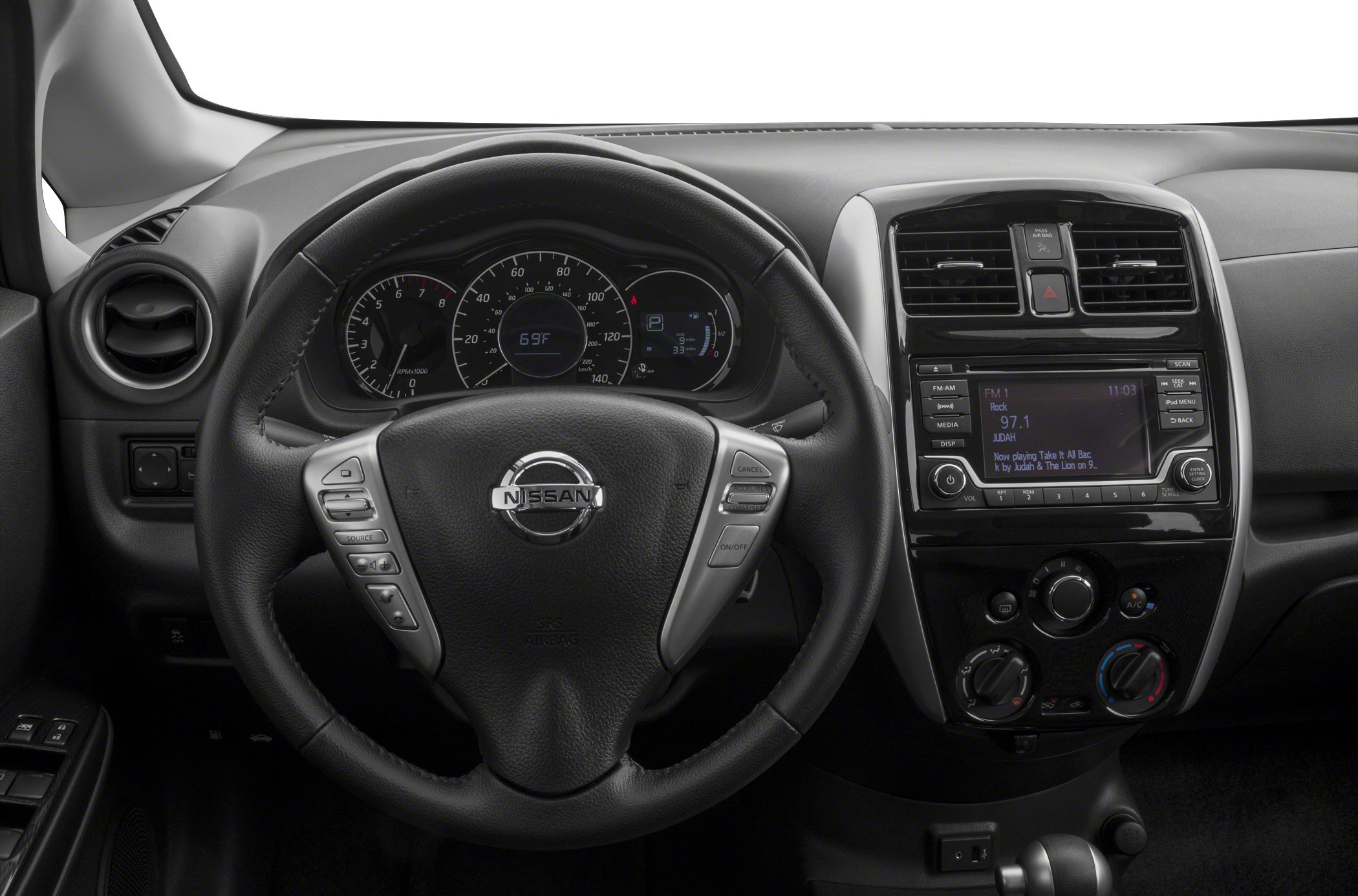 Steering wheel, instrument cluster, and center console with radio and climate controls