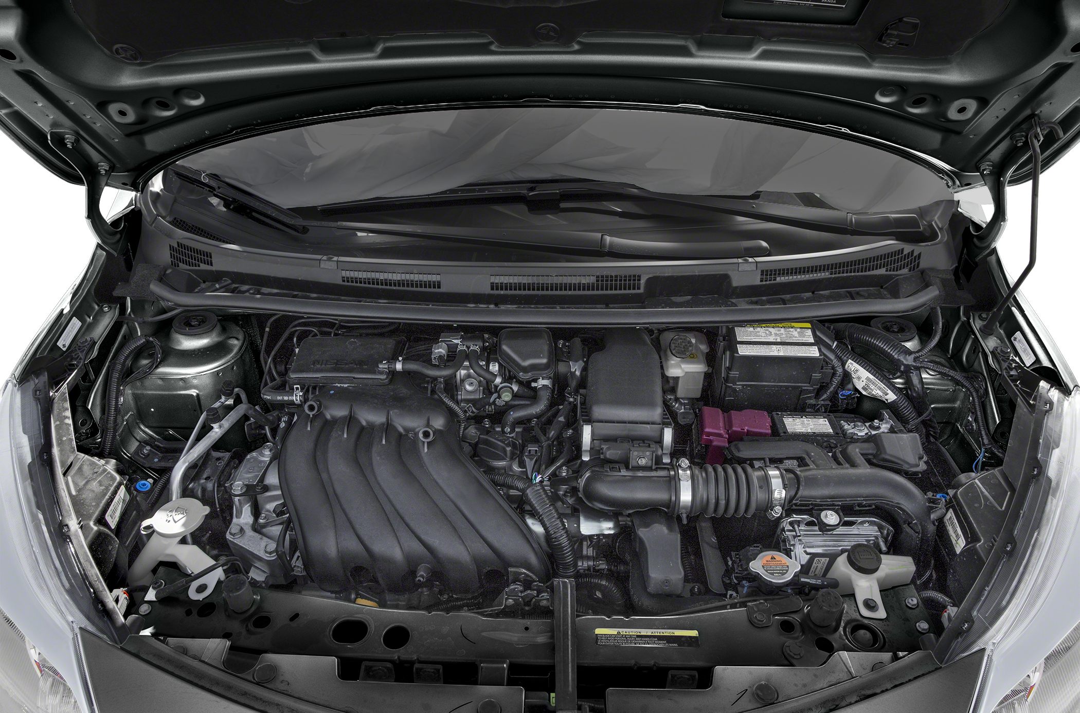 Engine bay with intake manifold, battery, coolant reservoir, and hoses