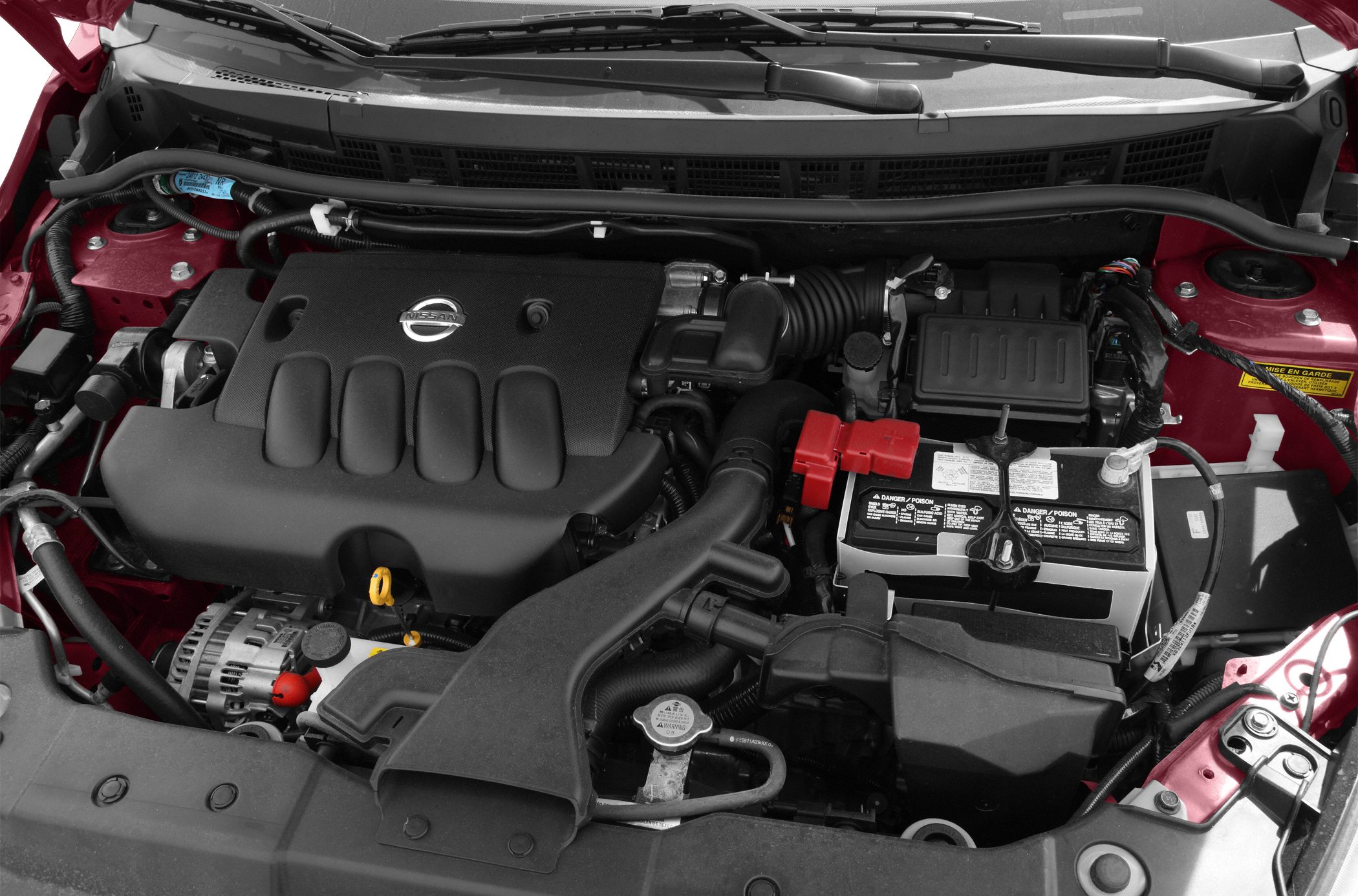 Engine bay with Nissan branded engine cover and battery compartment