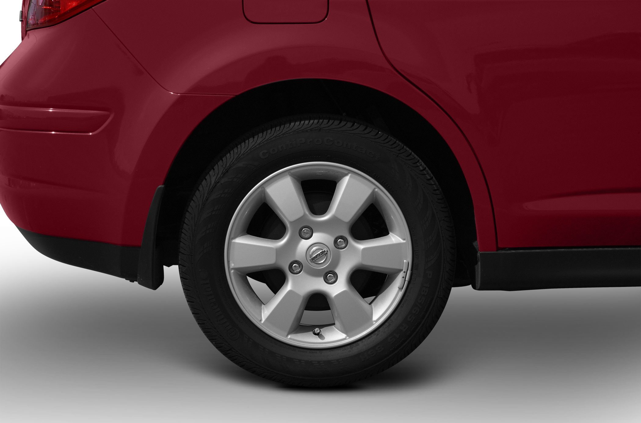 Rear alloy wheel and fender section of a hatchback