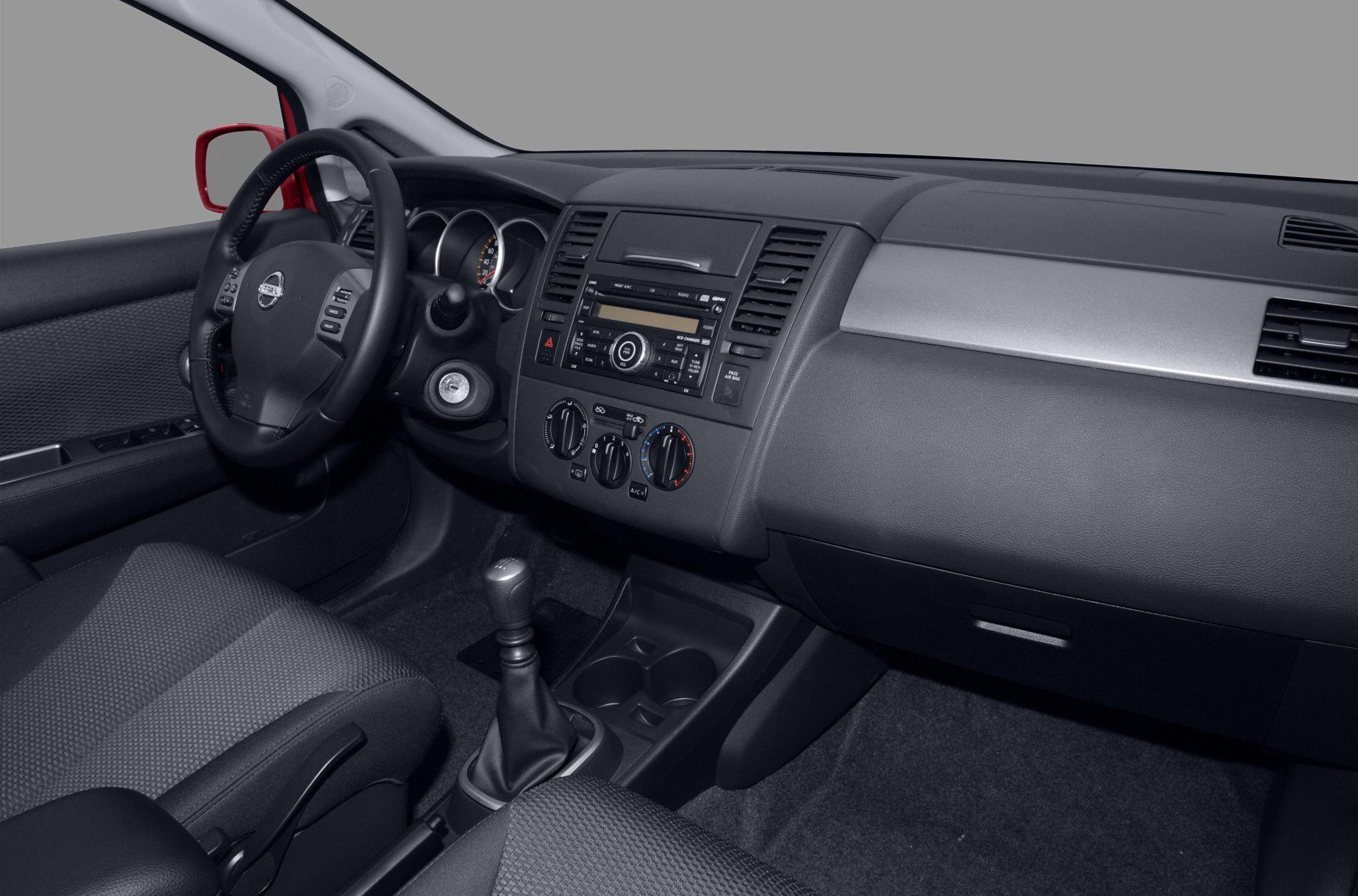 Interior dashboard and manual gearshift of a compact hatchback