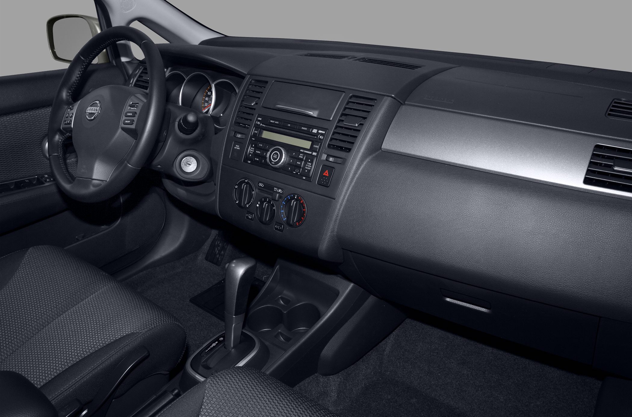 Car interior with dashboard, steering wheel, and automatic gear shift