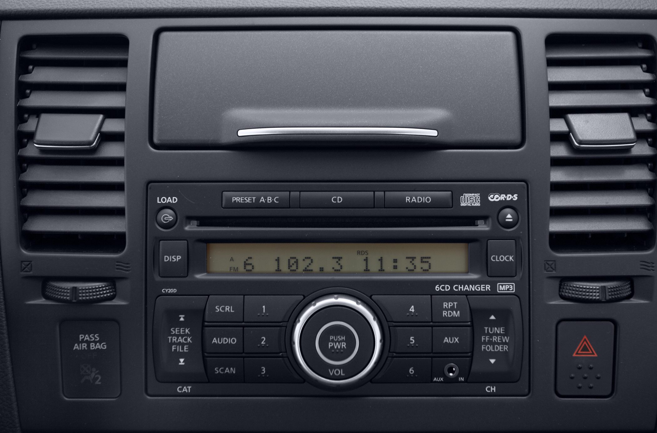 Factory radio and climate vent control panel with digital display and CD changer