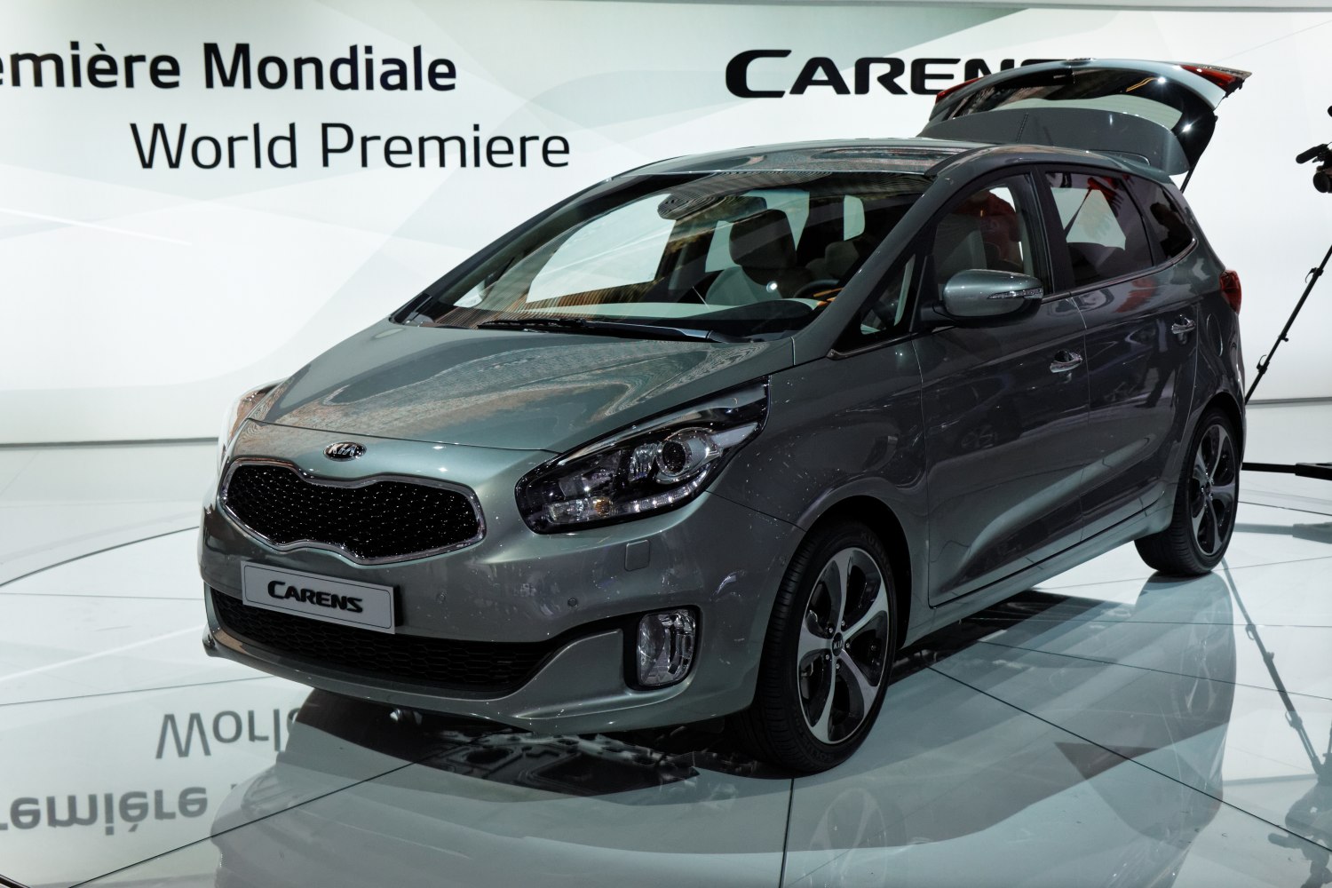 Modern compact MPV with sleek front and open hatchback