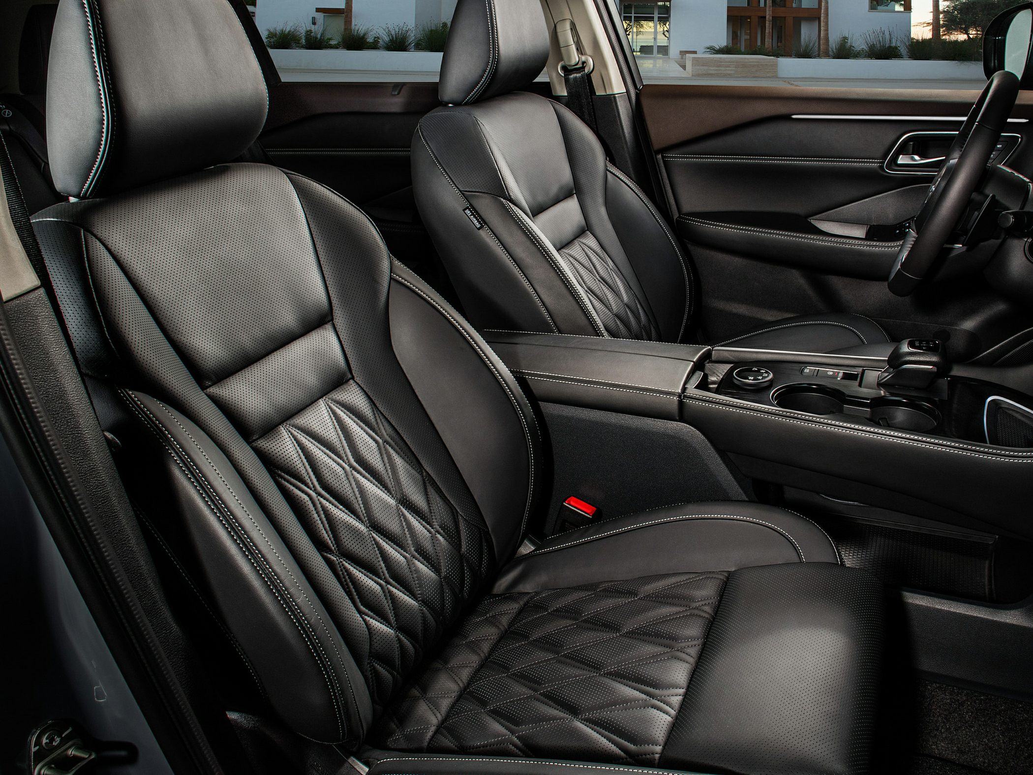 Black quilted leather front seats with detailed stitching and center console