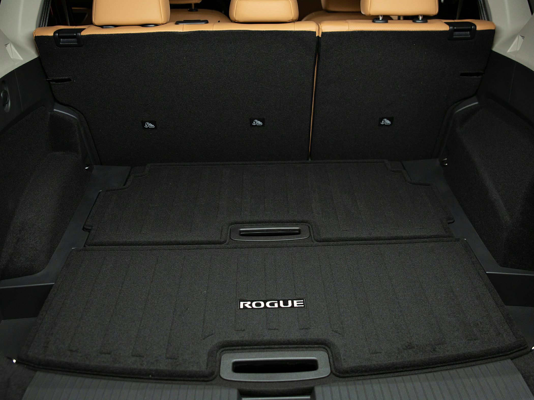Cargo area mat with rear seatbacks in two-tone interior.