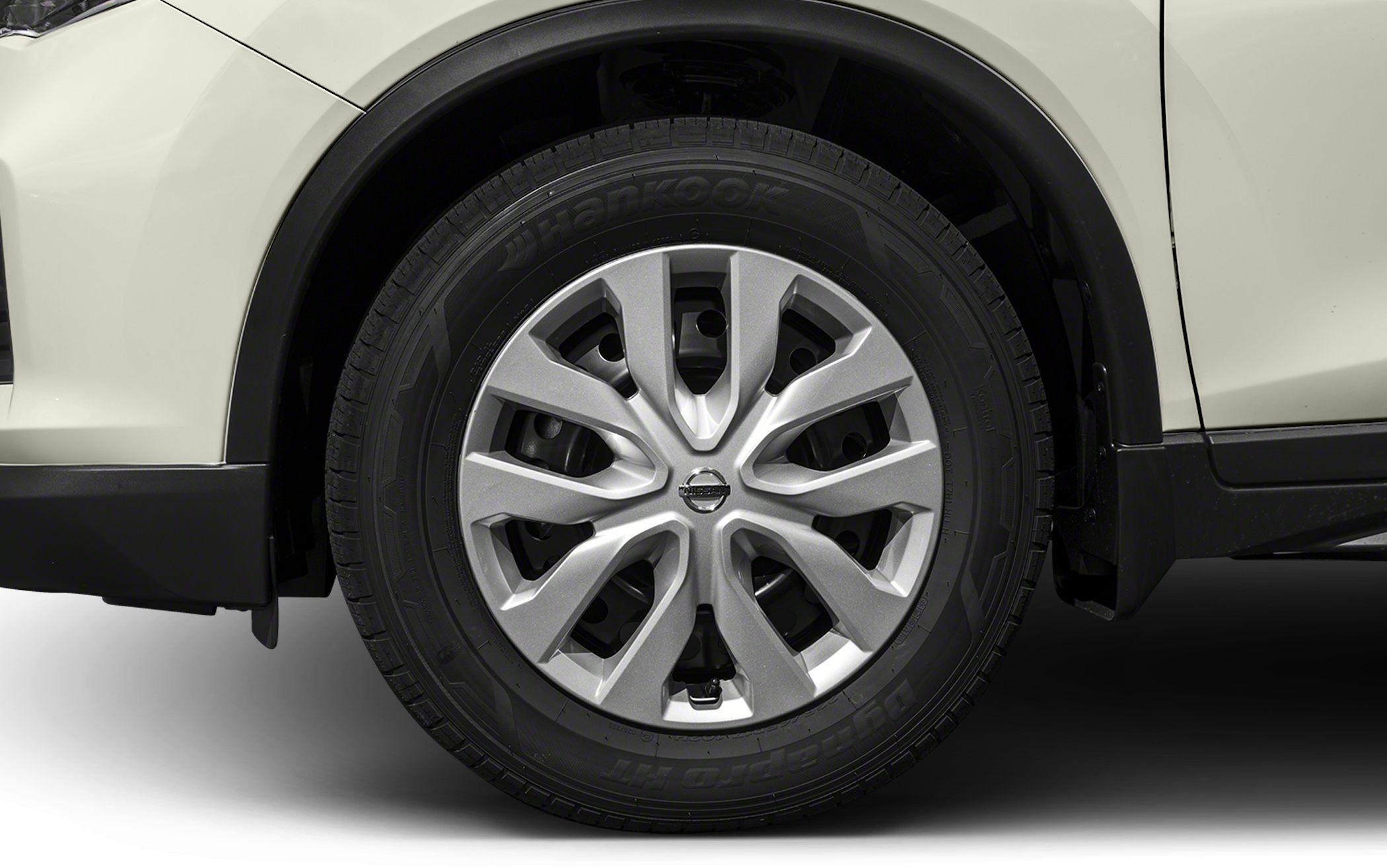 Alloy wheel and tire close-up with intricate spoke design and visible tire branding
