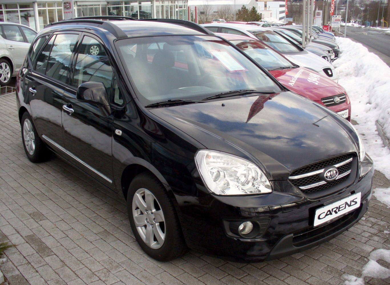 Front side view of sleek compact MPV with distinct headlights and alloy wheels