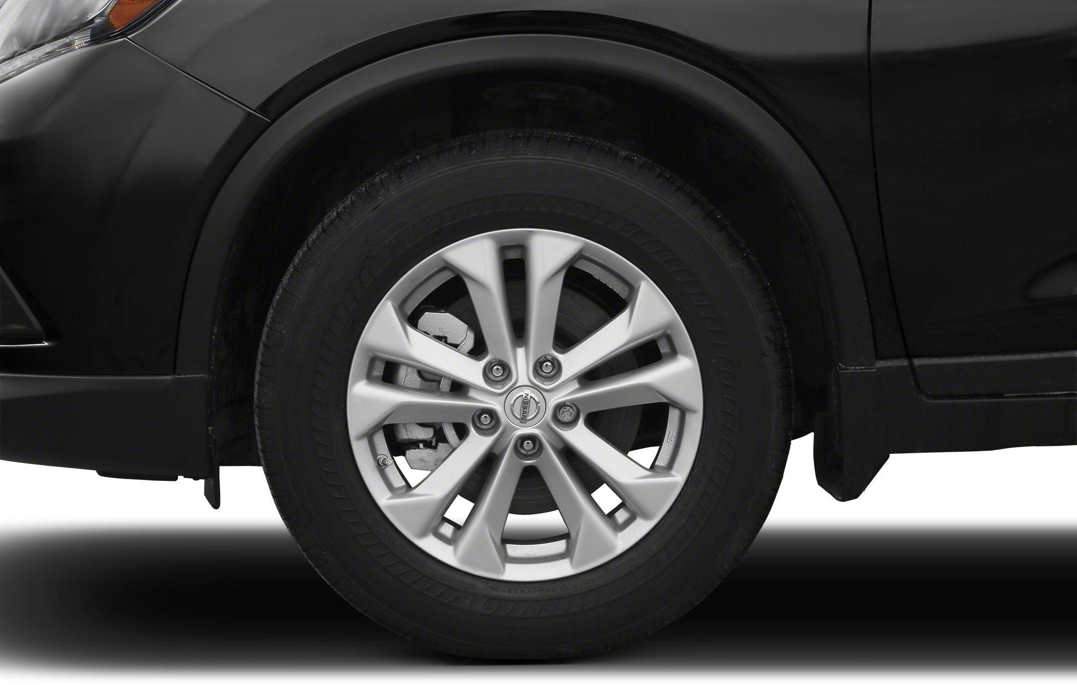 Close-up of alloy wheel and tire with visible brake disc.