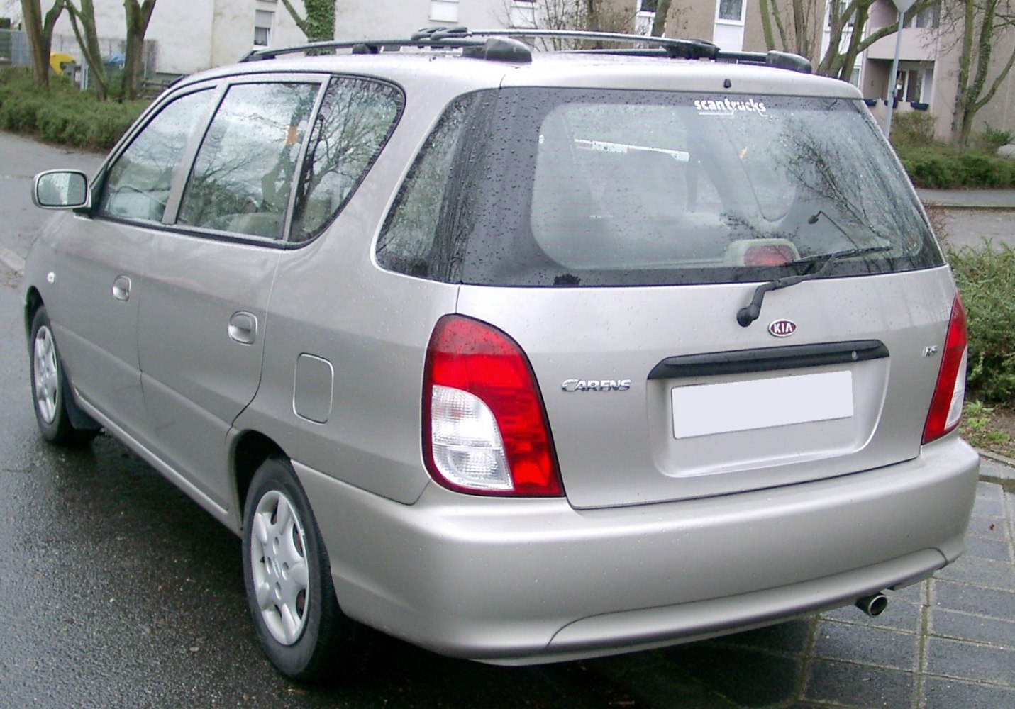 Rear and side view of a station wagon with distinctive taillights and roof rails