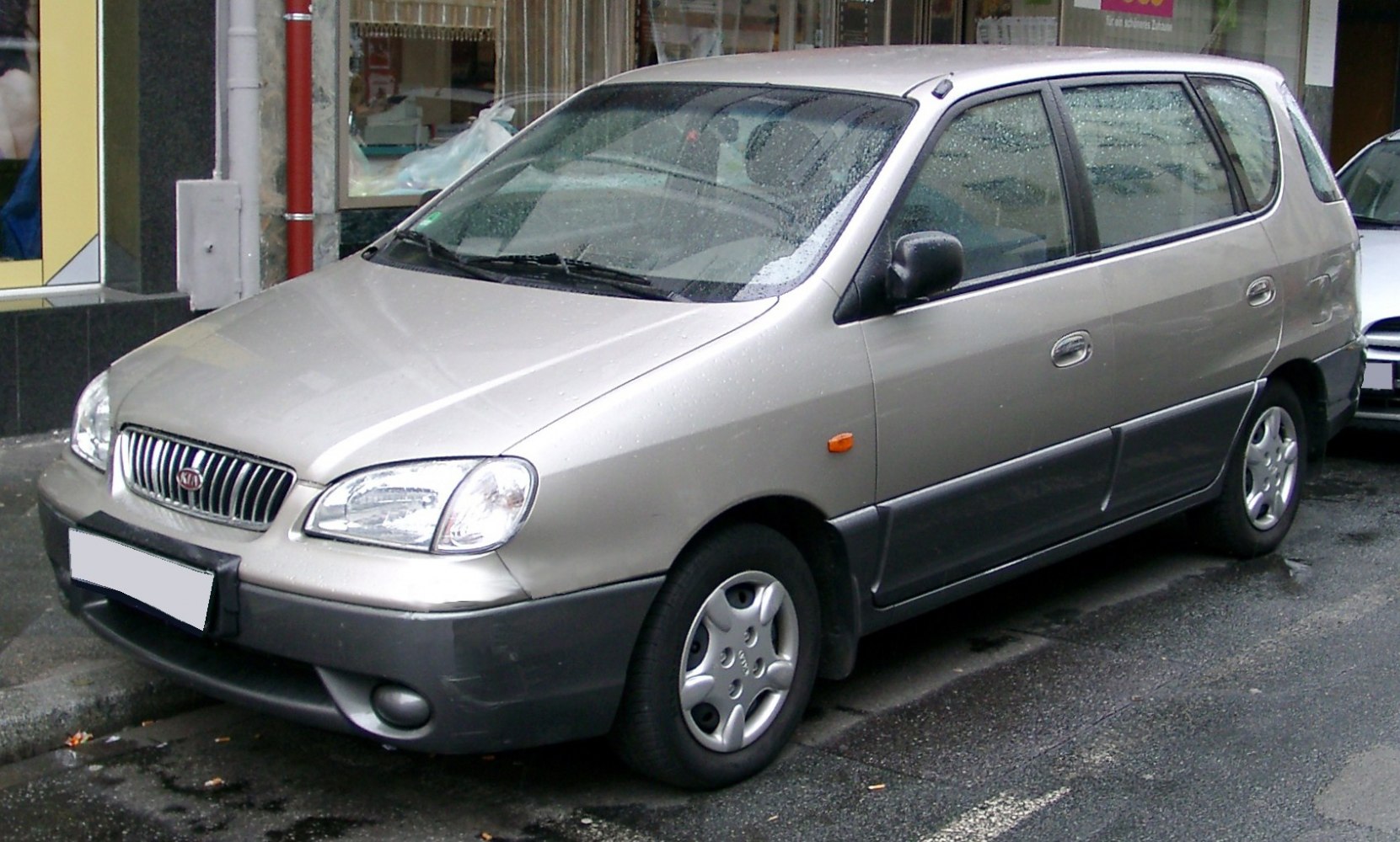 MPV with distinctive front grille and dual-color bumper.