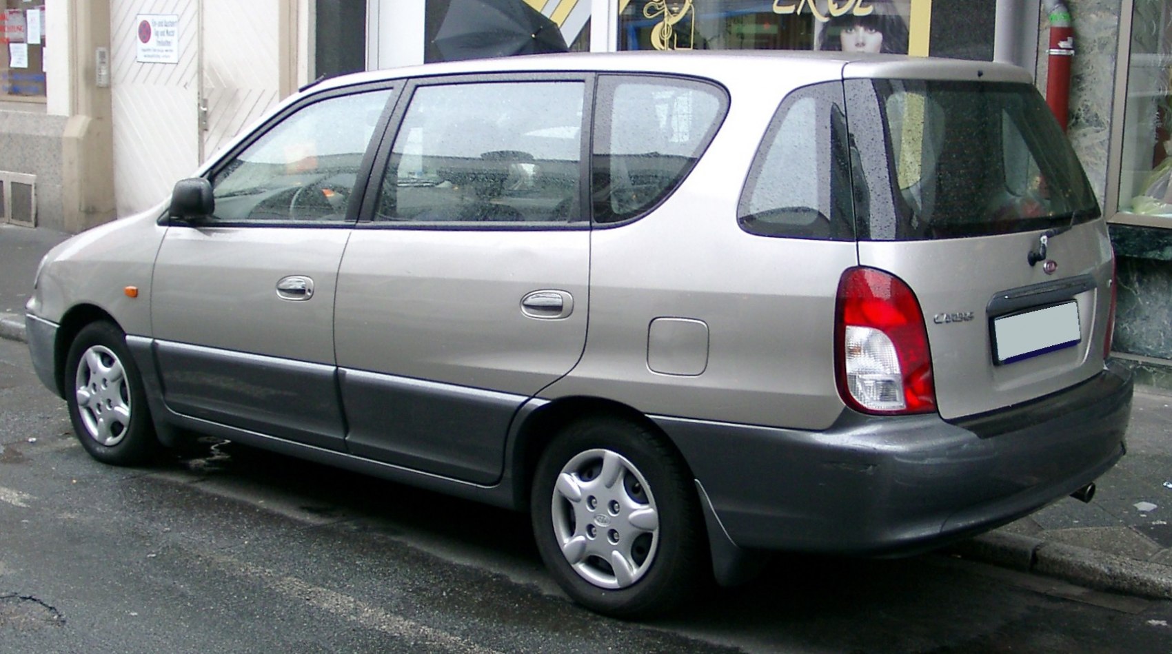 Rear side view of a 1999 family MPV with compact minivan design