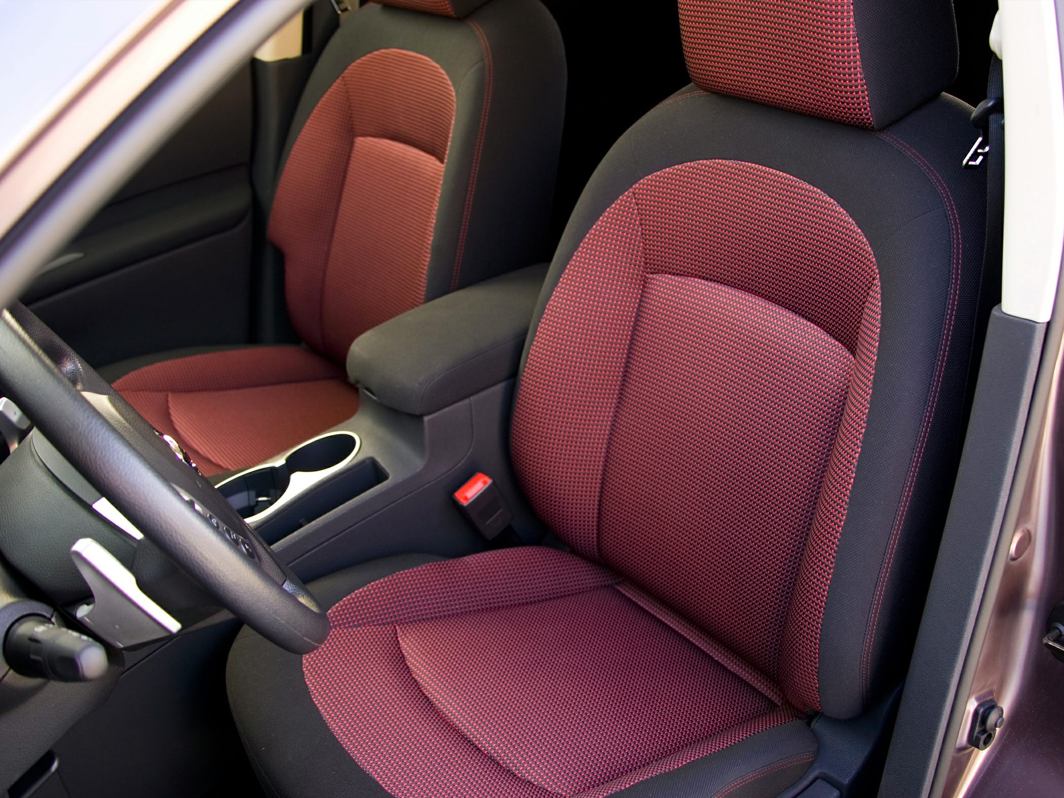 Red and black fabric front seats with center console