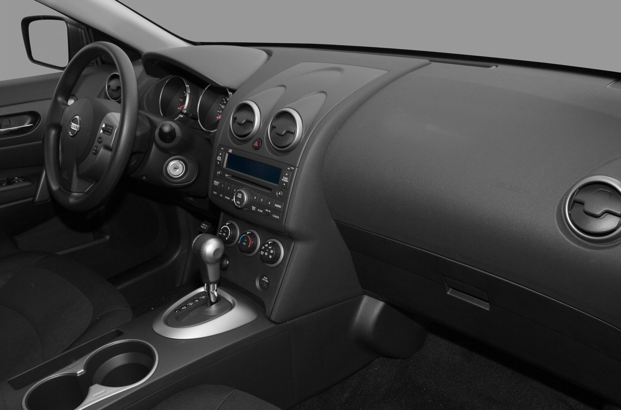 Dashboard and center console with automatic gear shift and round air vents