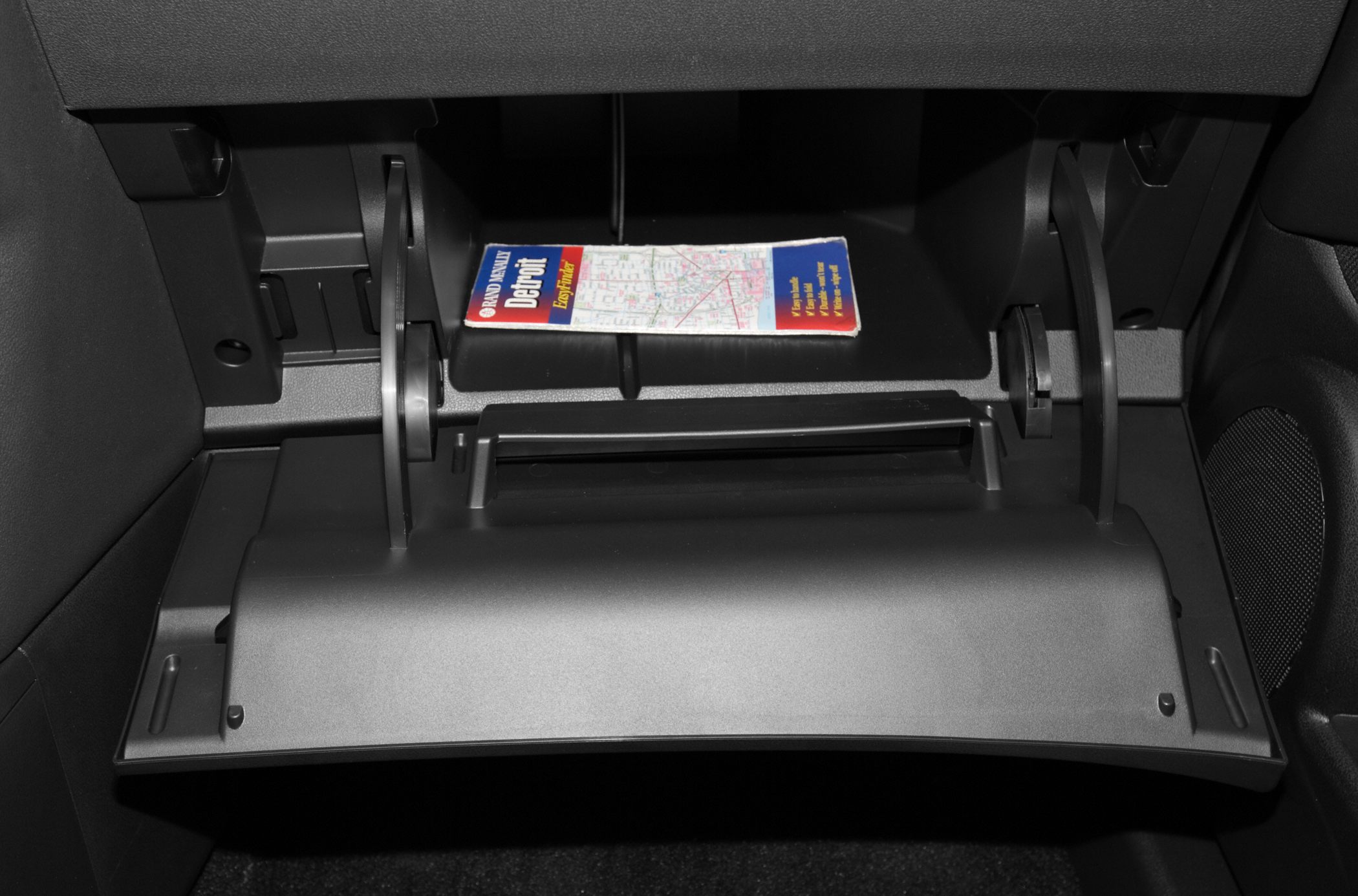 Open glove compartment with map inside