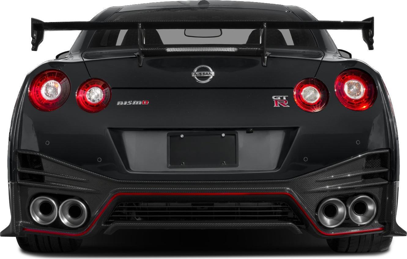 Rear view with quad exhausts, circular taillights, and large carbon fiber spoiler