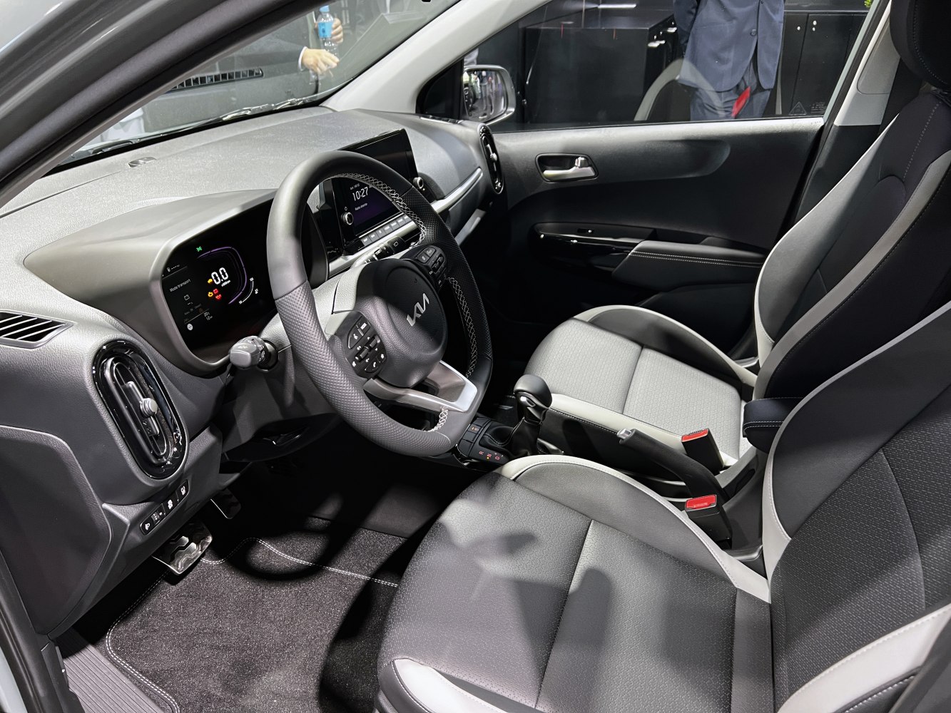 Digital dashboard and ergonomic front seats with steering wheel controls