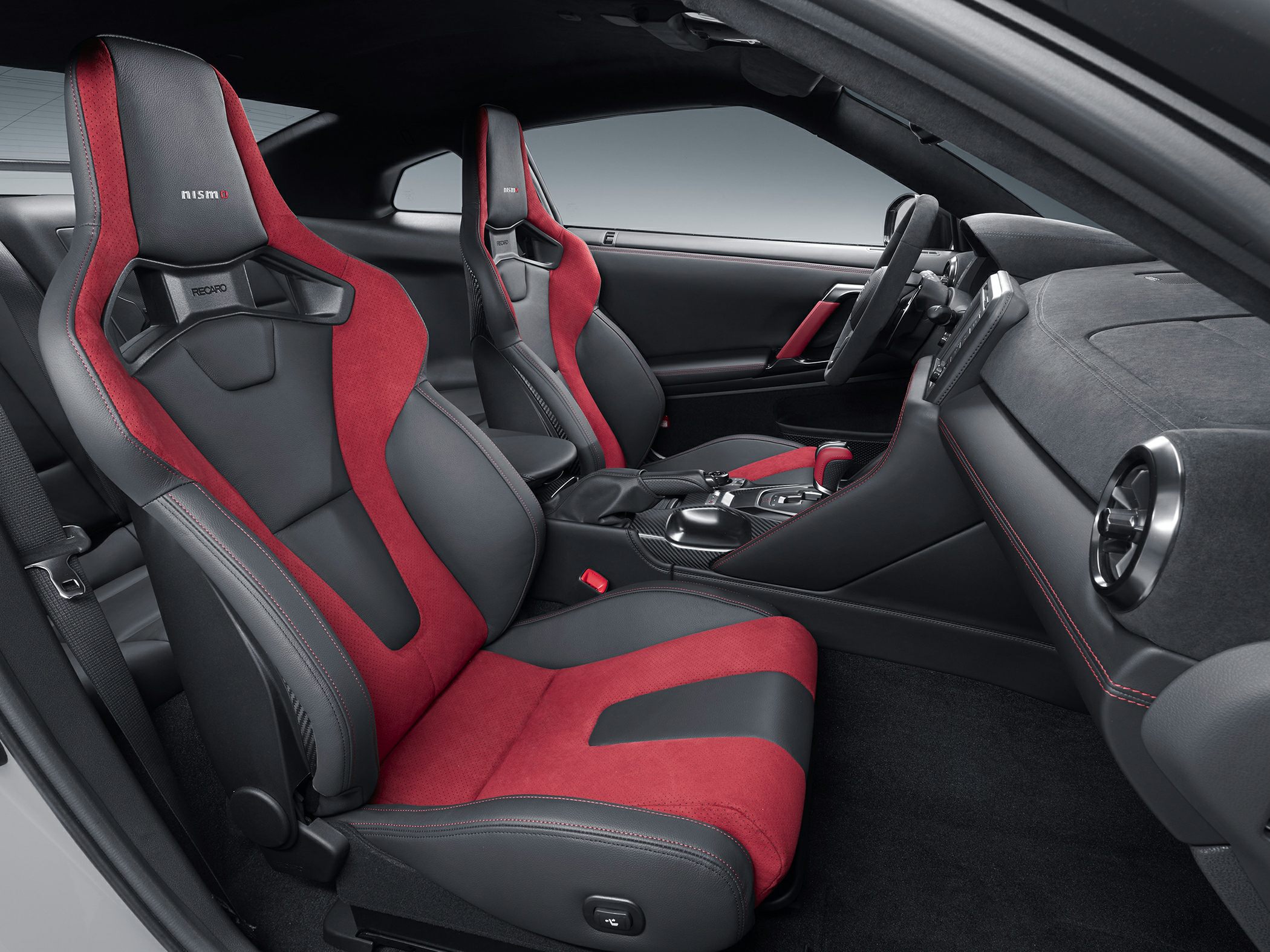 Red and black Recaro racing seats with premium dashboard and sporty interior trim