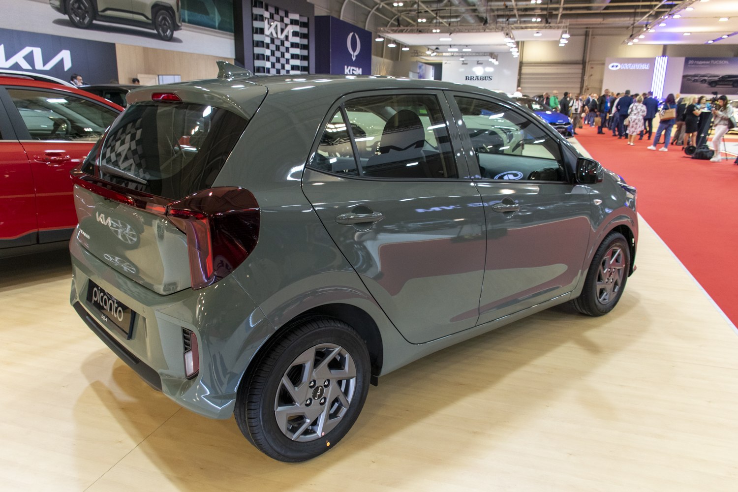 Rear and side view of compact hatchback with modern styling and signature lighting.