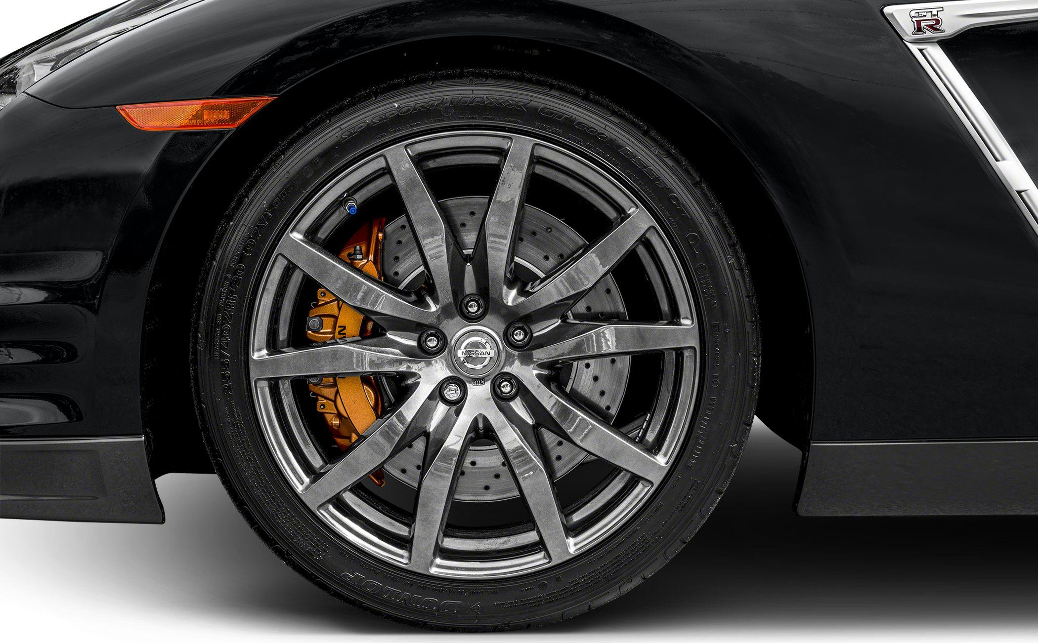 Multi-spoke alloy front wheel with orange brake caliper