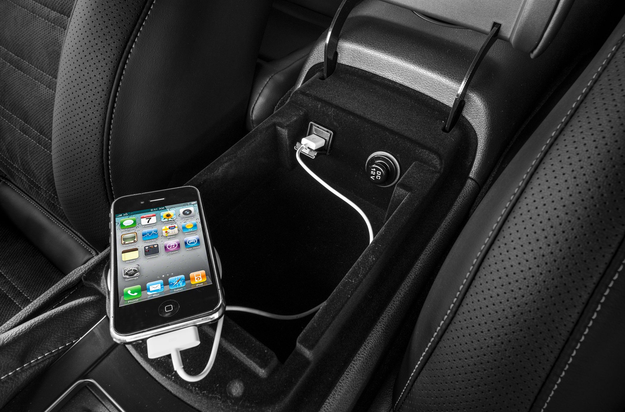 USB charging port and 12V power outlet in car center console