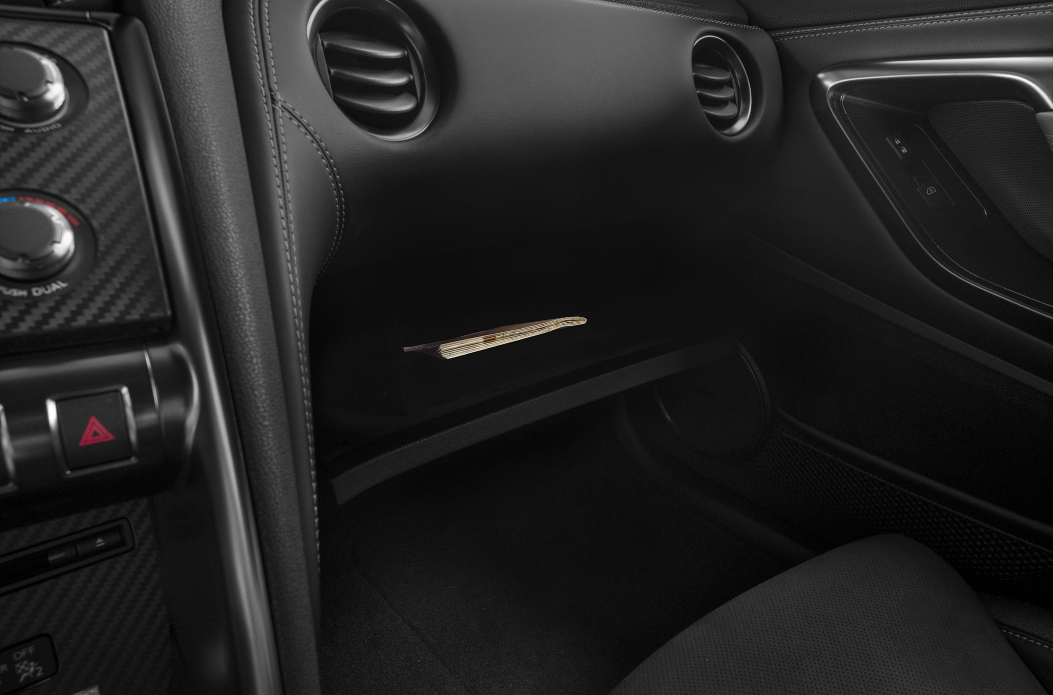 Black leather interior with dashboard and twin circular air vents