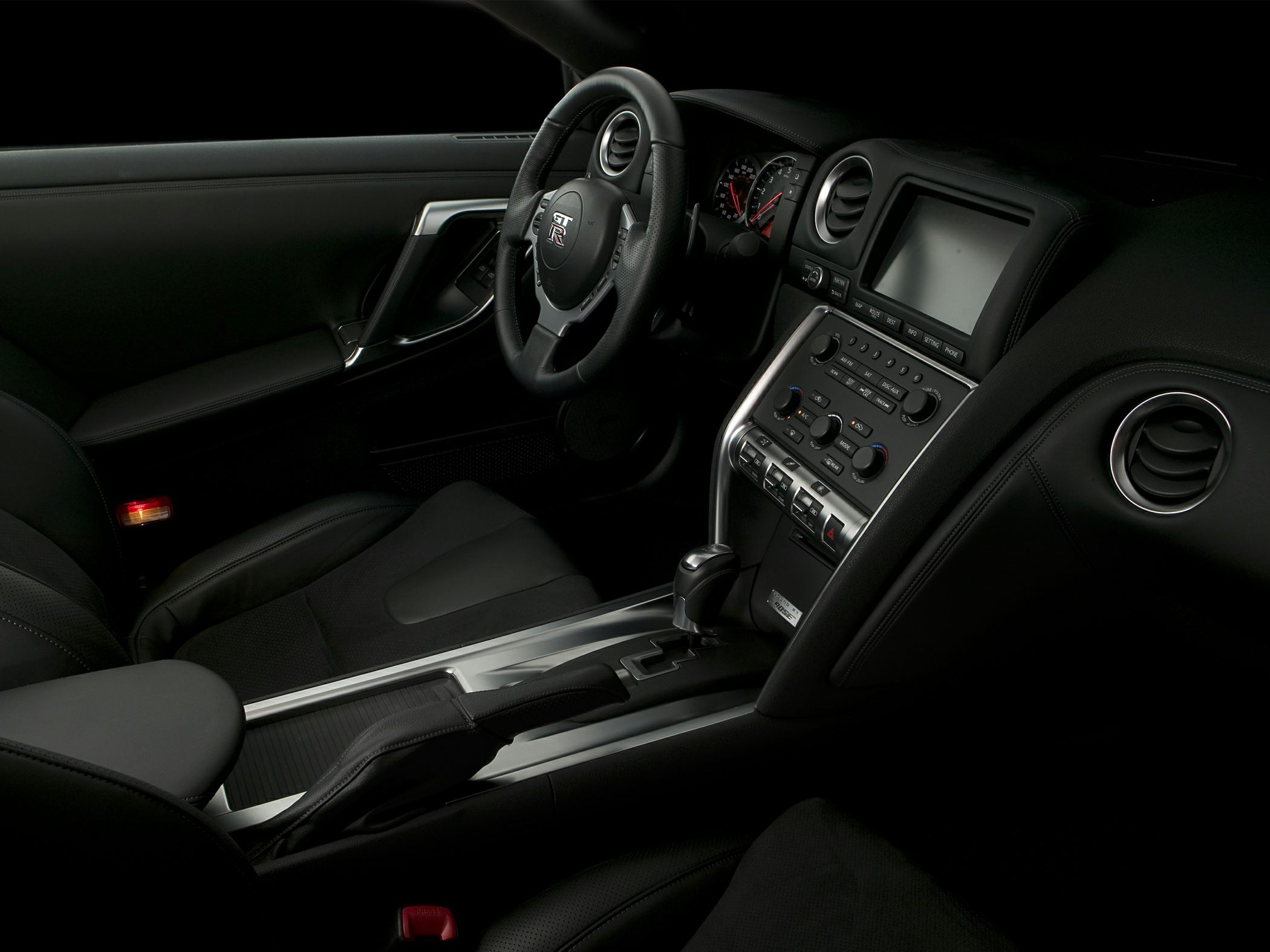 Interior with dashboard, steering wheel, center console