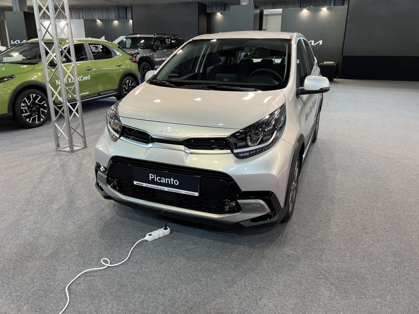 Front view of modern headlights and grille on a compact hatchback