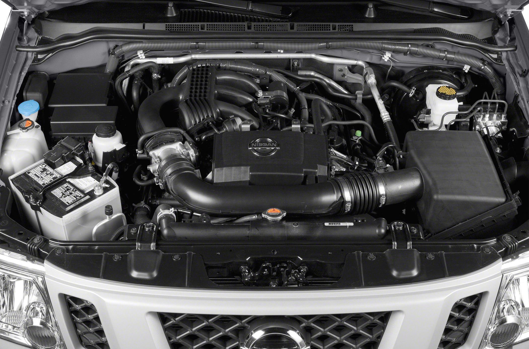 Engine bay with visible intake, battery, and fluid reservoirs.