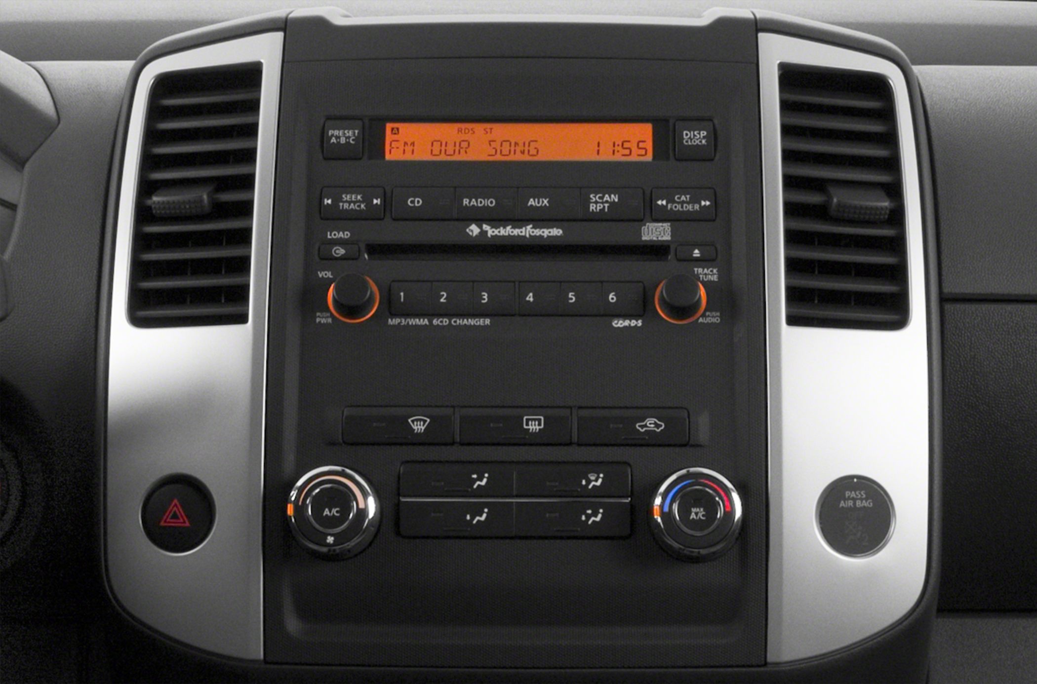 Car audio system and climate control panel with dual air vents.