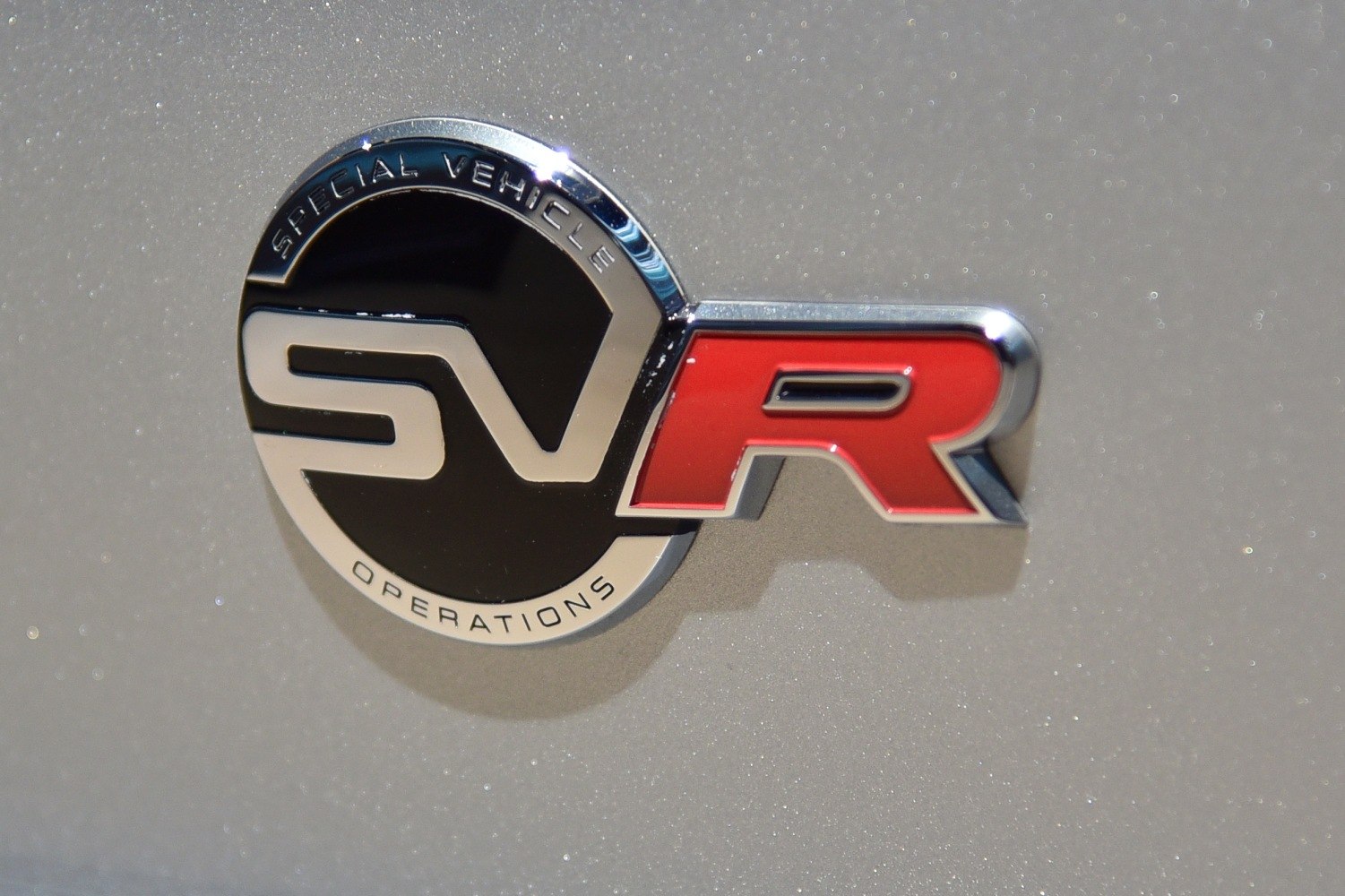 Close-up of SVR badge emblem on metallic paint