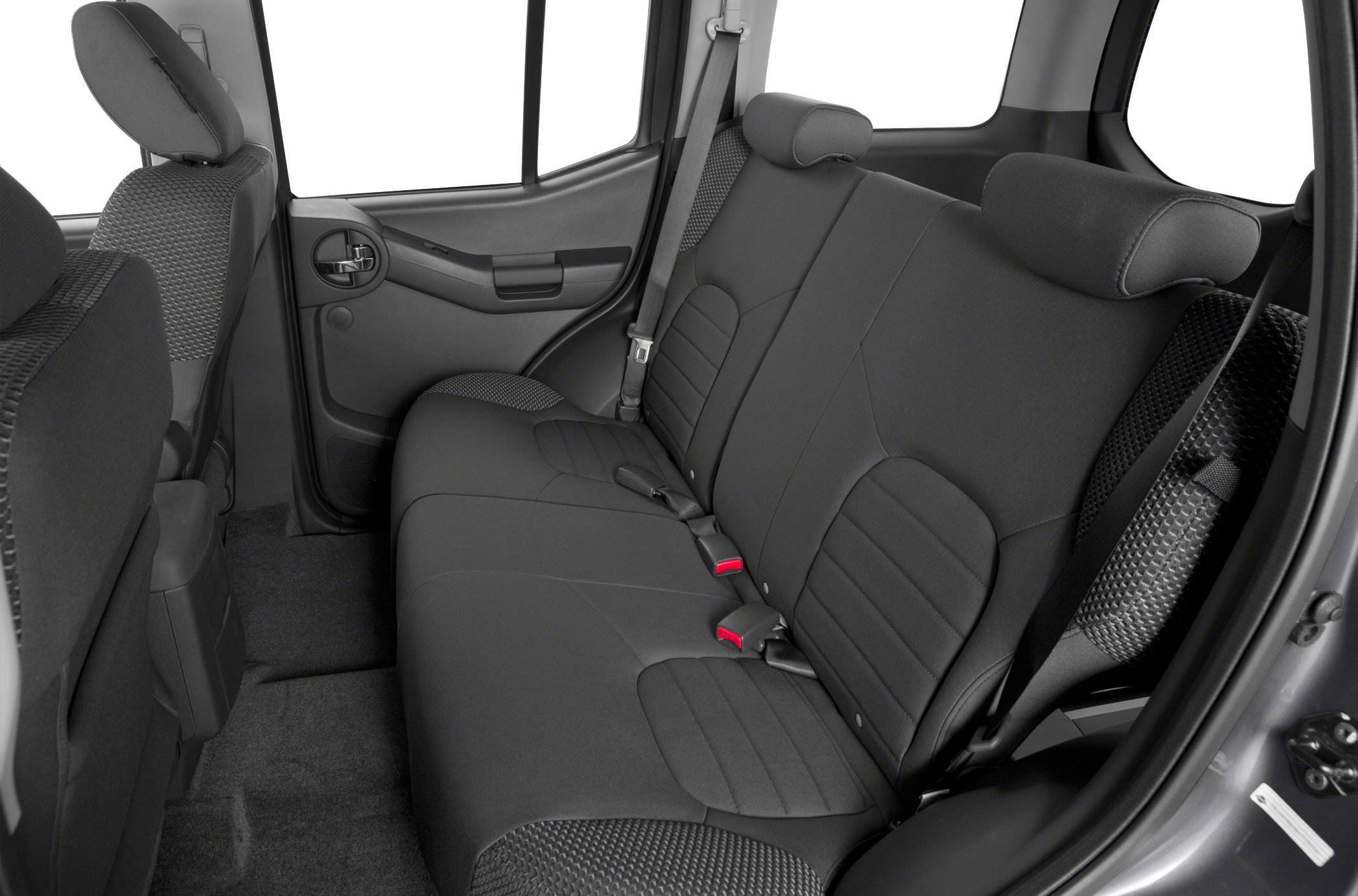 Rear seat and door panel interior with fabric upholstery and seatbelts