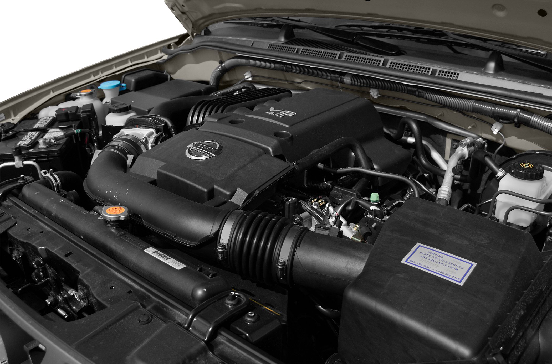 Detailed view of V6 engine bay with air intake and radiator components