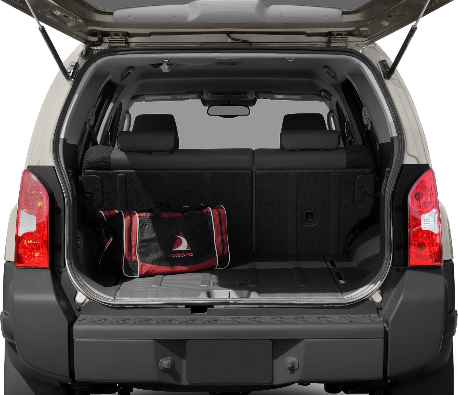 Spacious open trunk with rear seats upright and a red-black duffel bag inside