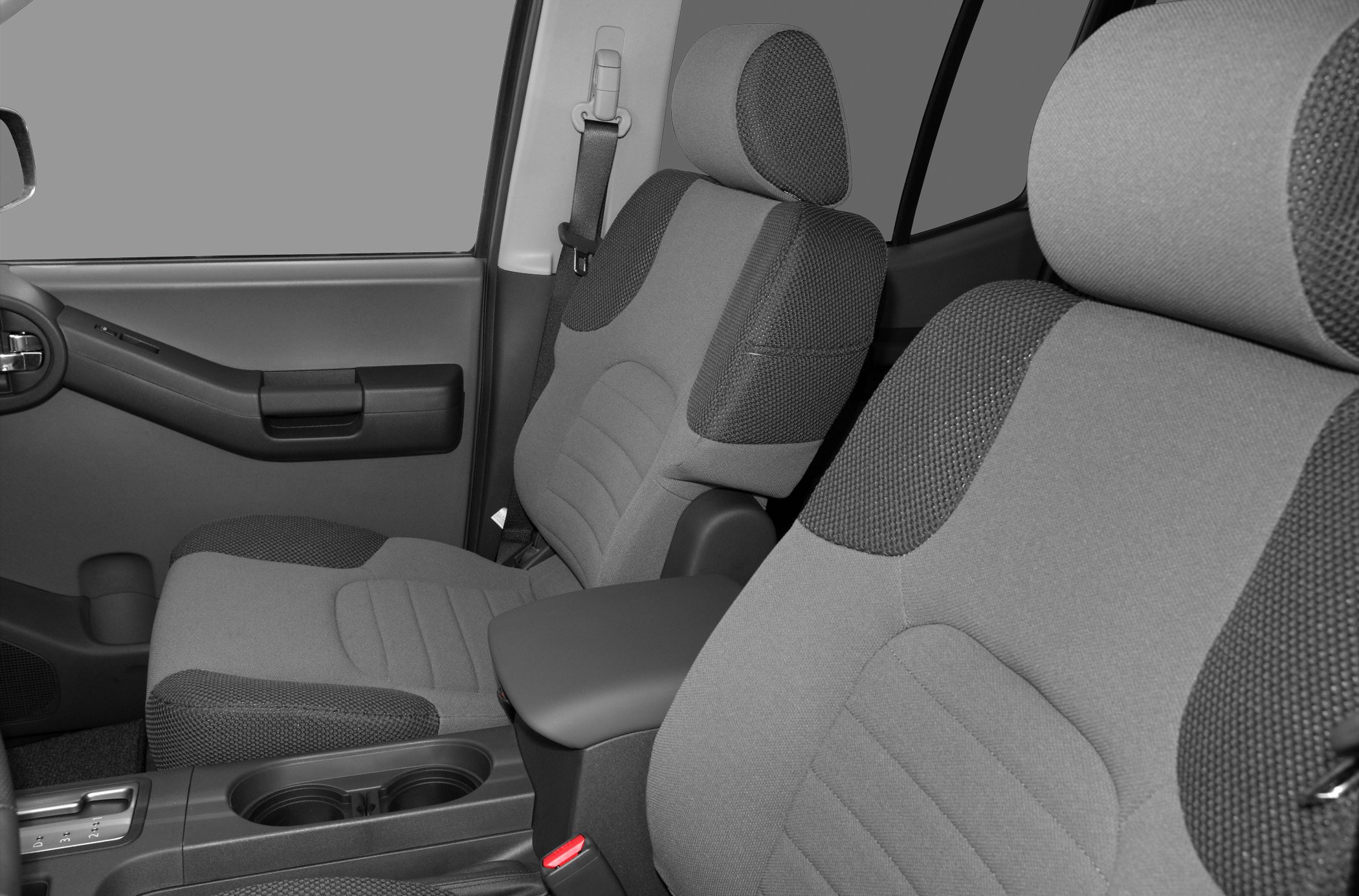 Close-up of front seats, door panel, and cup holders