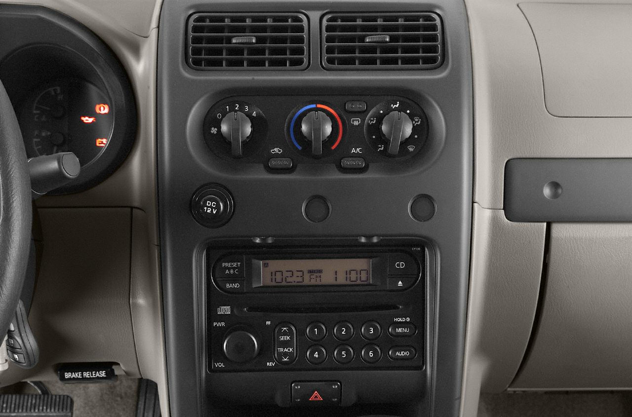 Dashboard controls and radio system of a 2000s vehicle