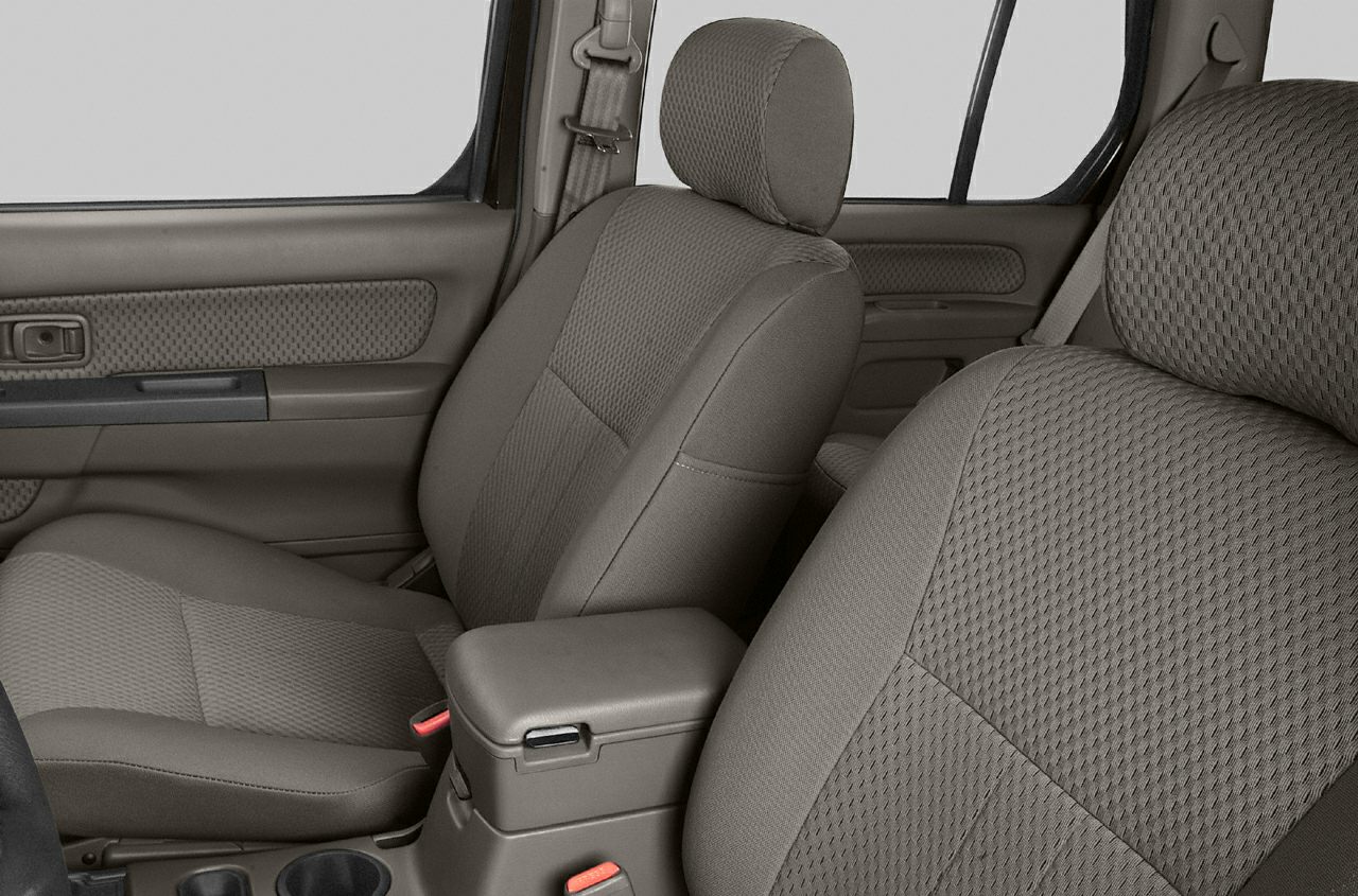 Front seats and interior door panel with fabric upholstery and armrest