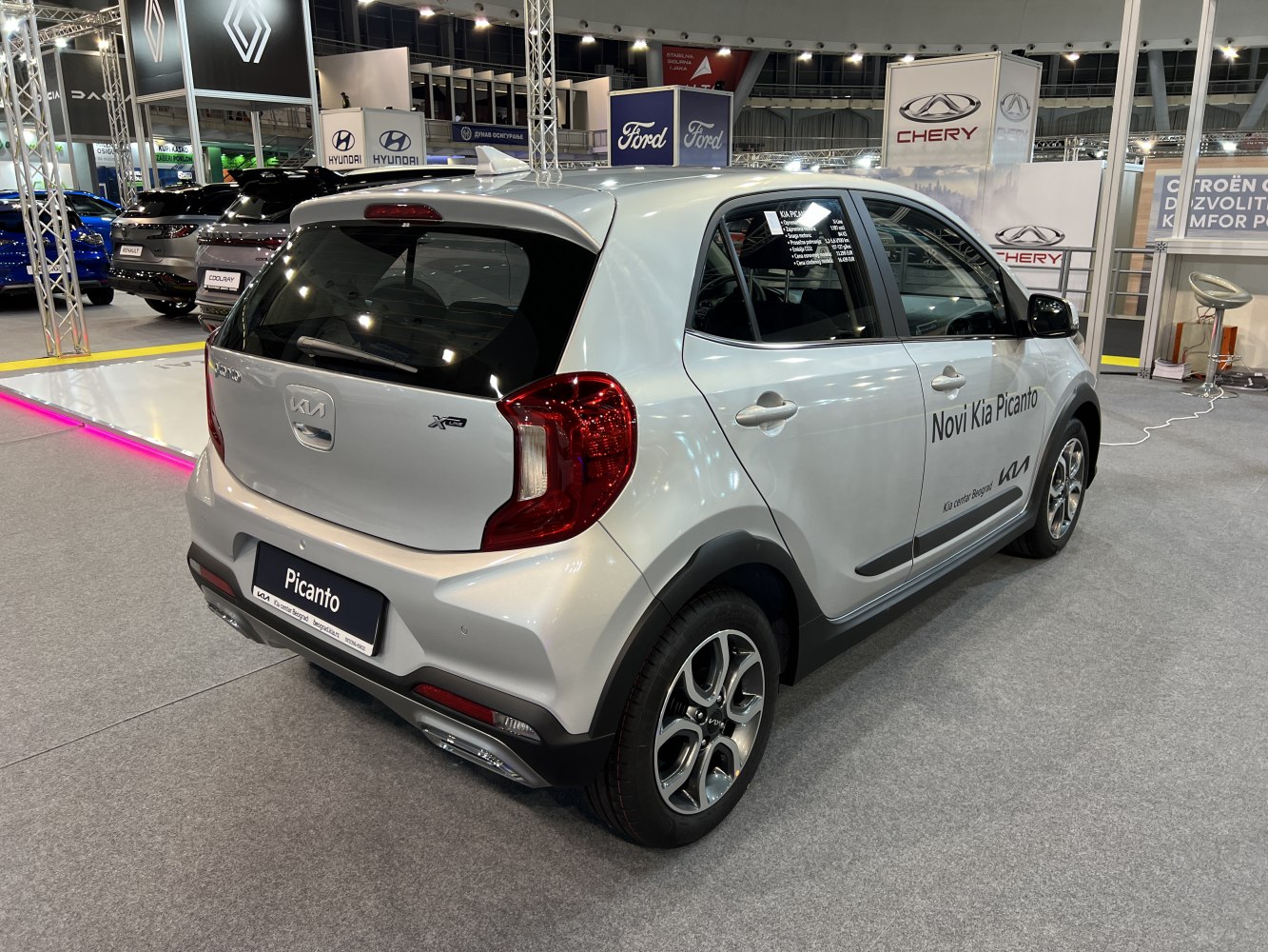 Rear and side view of compact hatchback with distinct tail lights and alloy wheels.