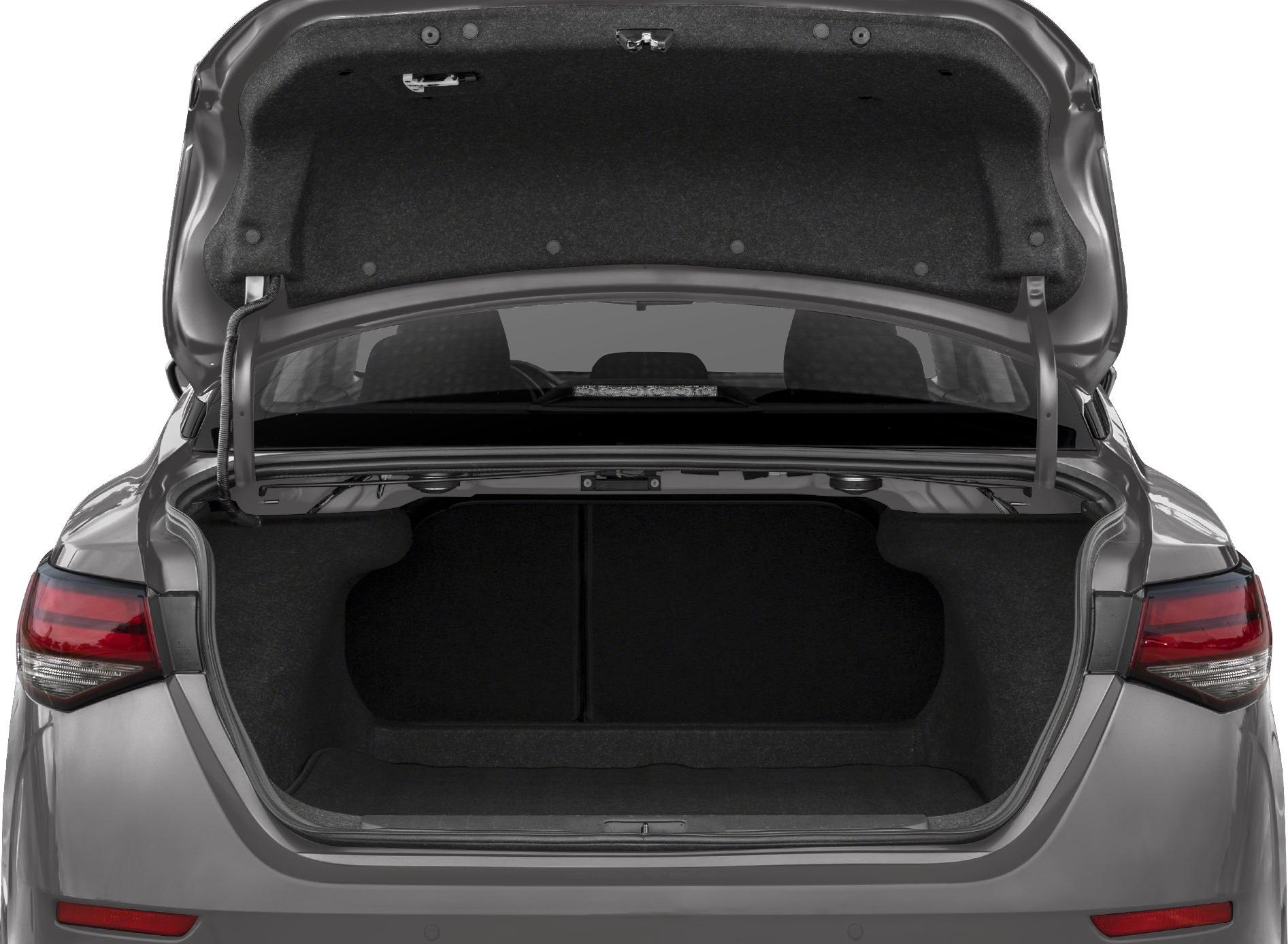 Open spacious sedan trunk with carpeted interior and rear seat visibility