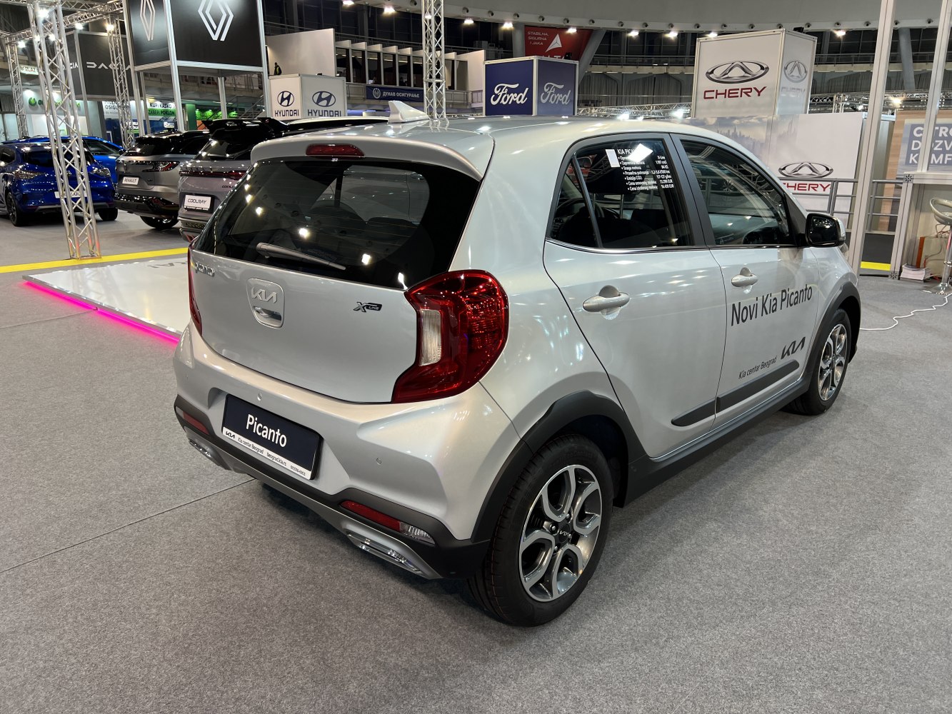 Rear view of a compact hatchback with LED taillights and alloy wheels.