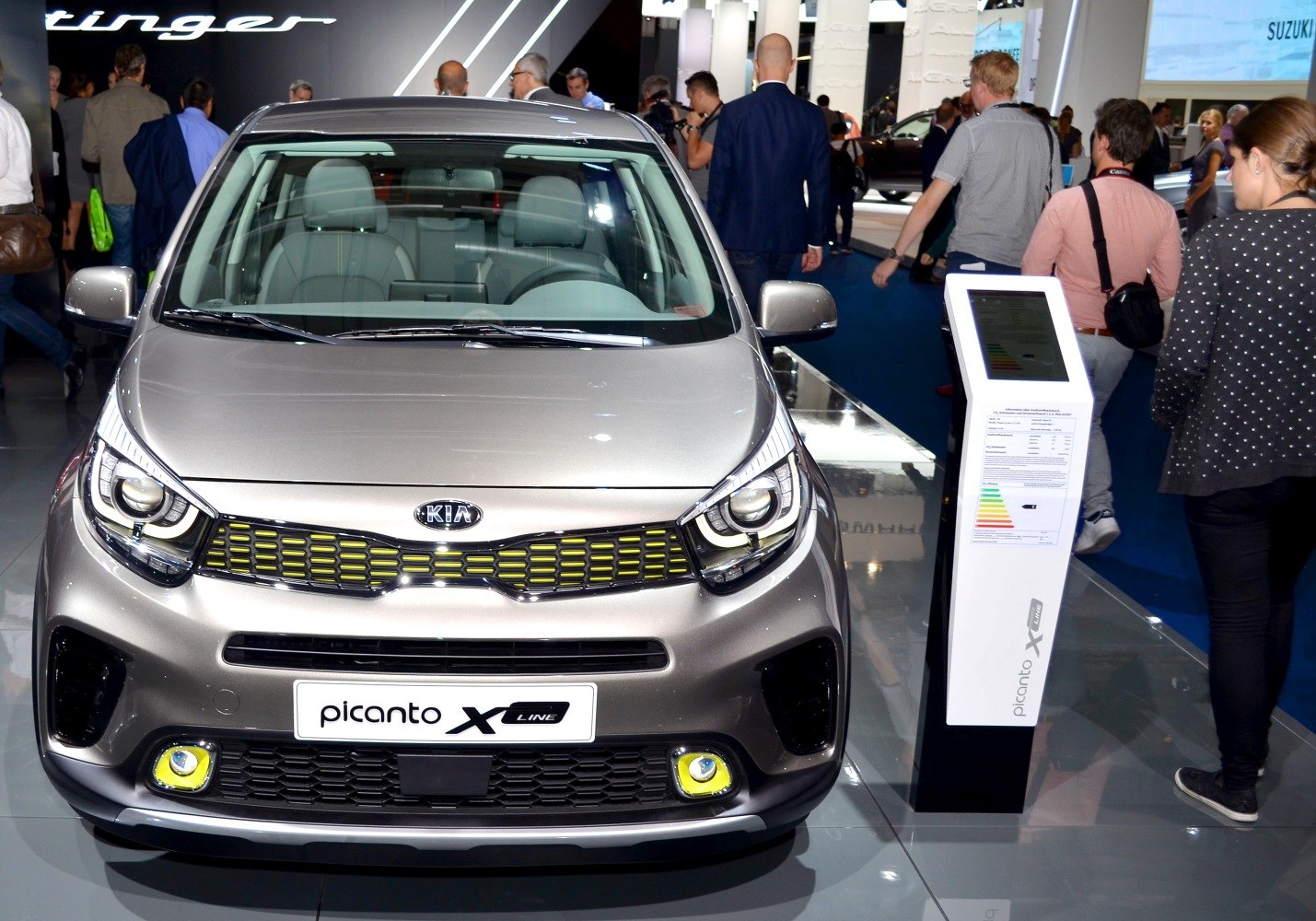 Front with unique headlights and yellow-accented grille