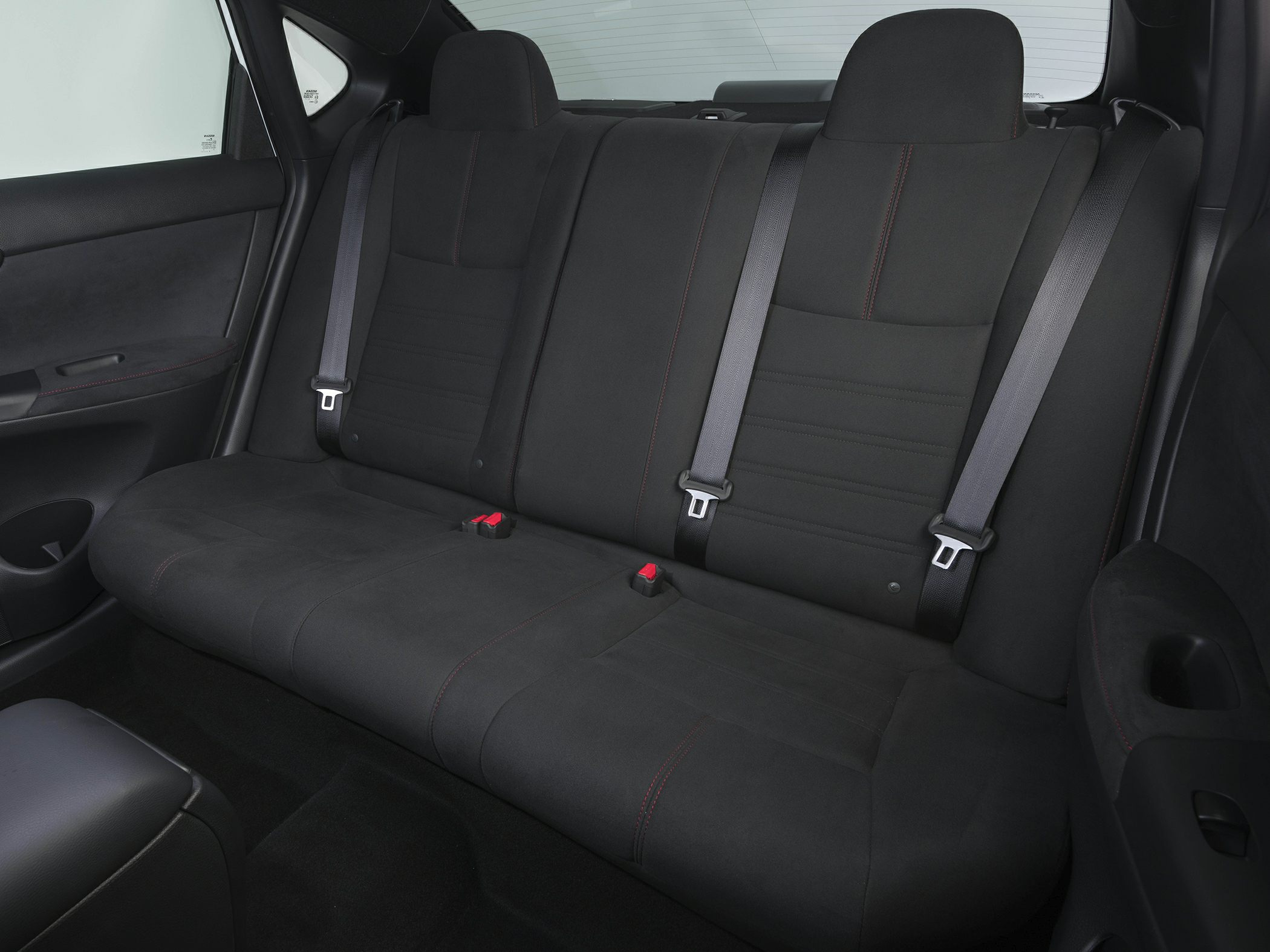 Rear seating with black upholstery and seat belts