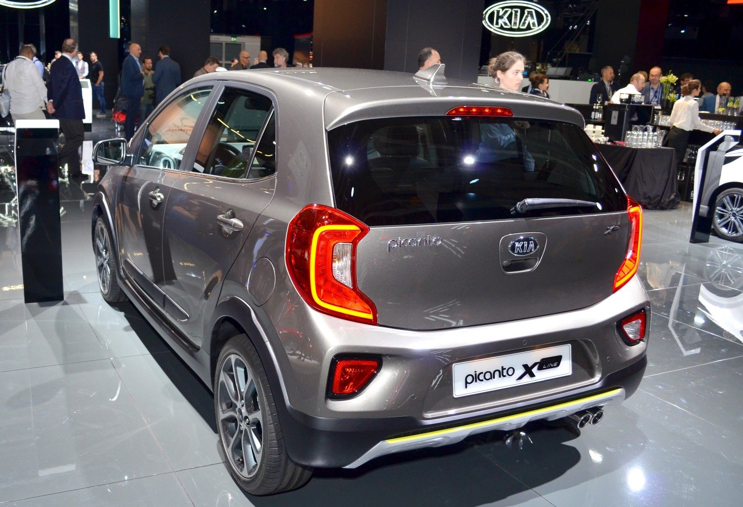Rear and side view with distinct tail lights and alloy wheels