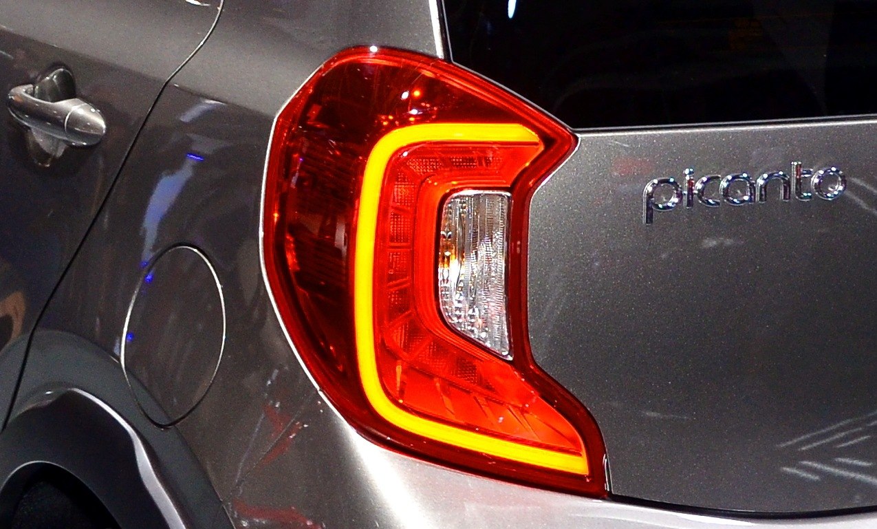 Close-up of a car's rear LED taillight and adjacent side panel.