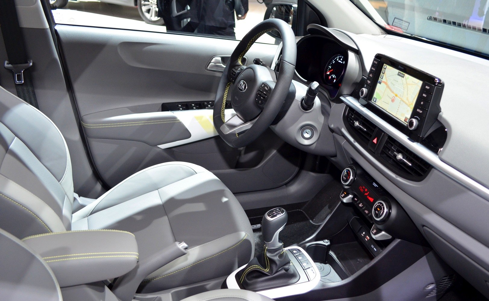 Manual transmission gearshift with touchscreen navigation and climate controls