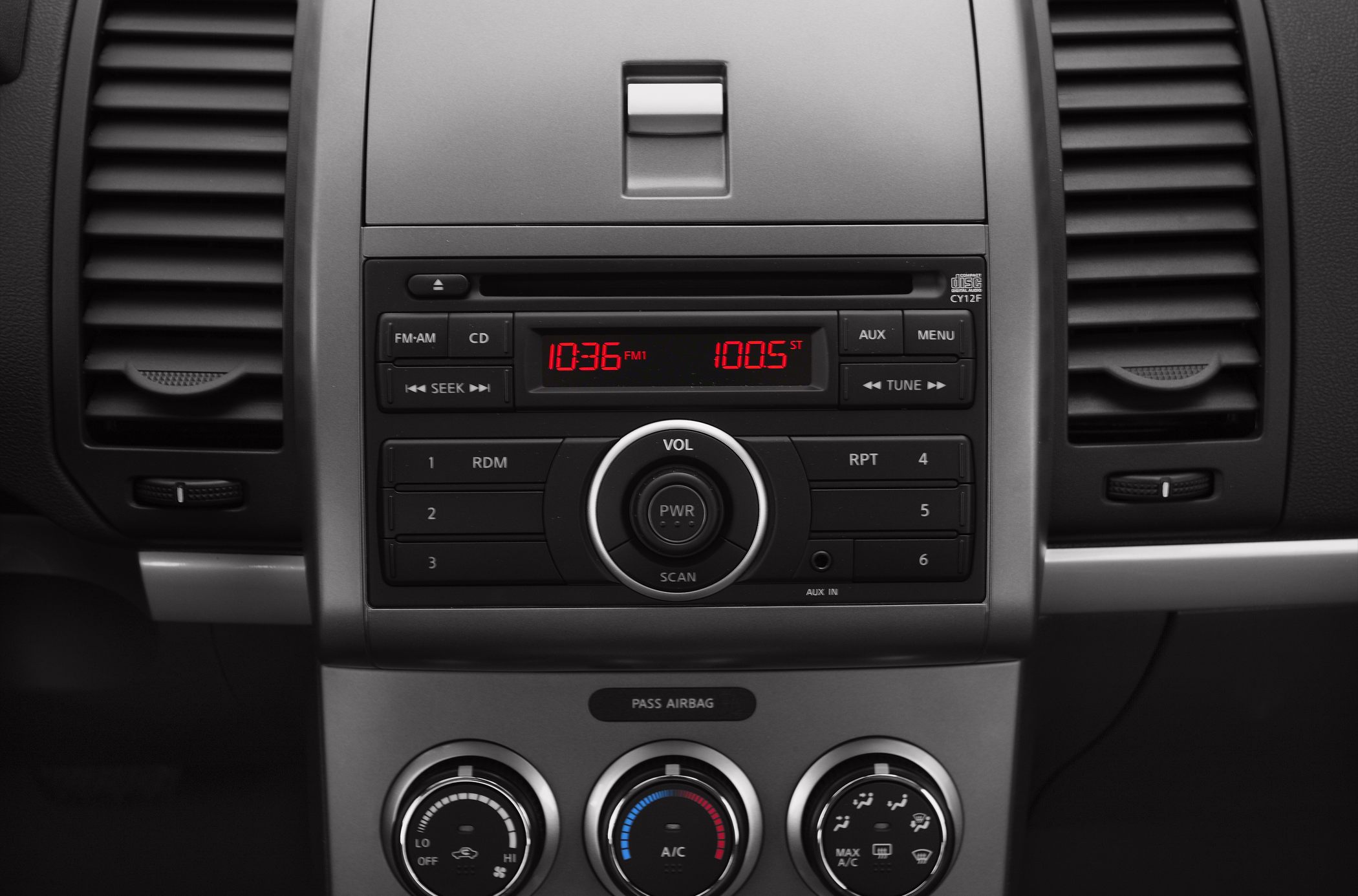 Dashboard center console with radio and climate control dials