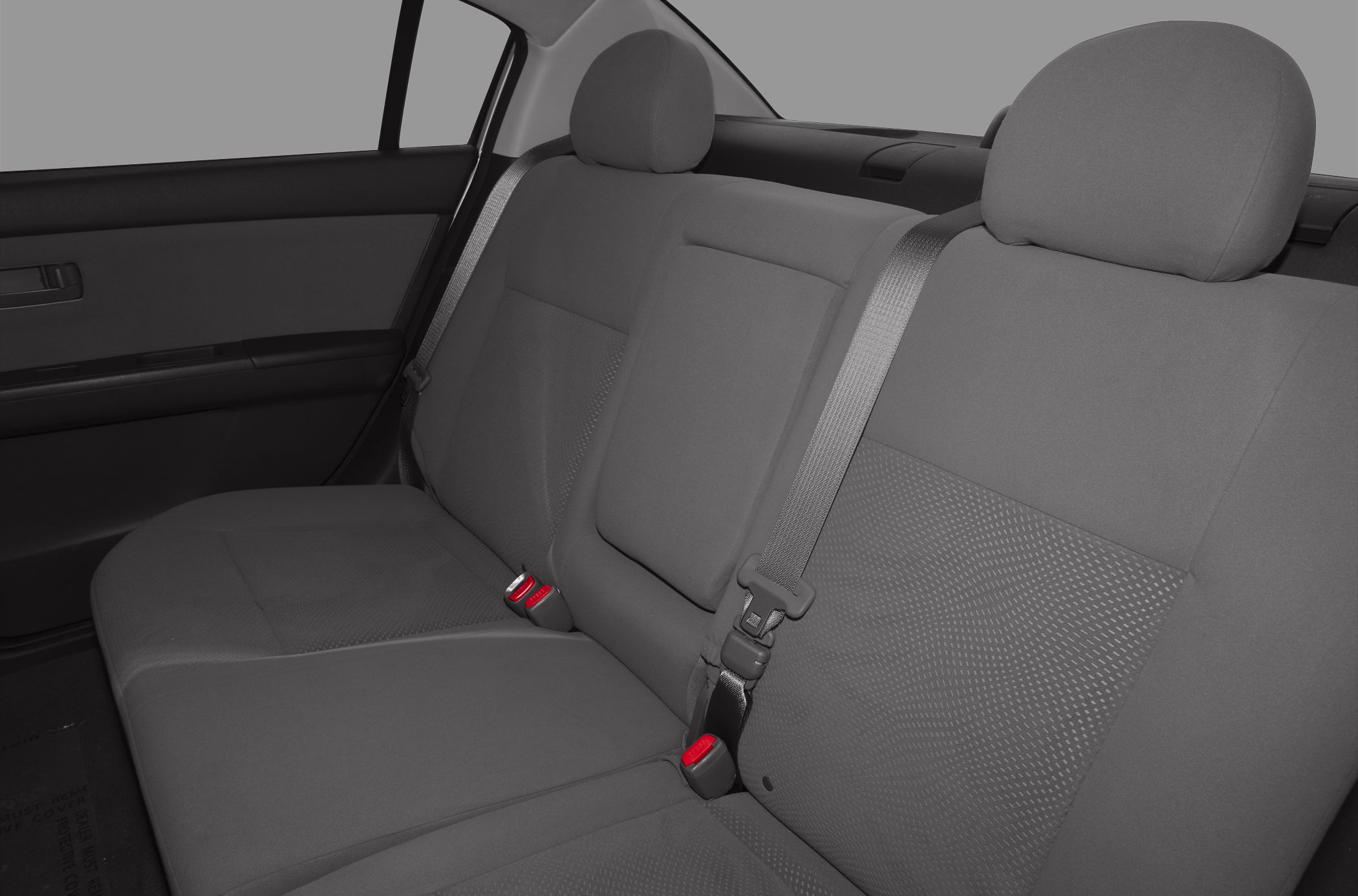 Rear seat fabric upholstery with seat belts and headrests