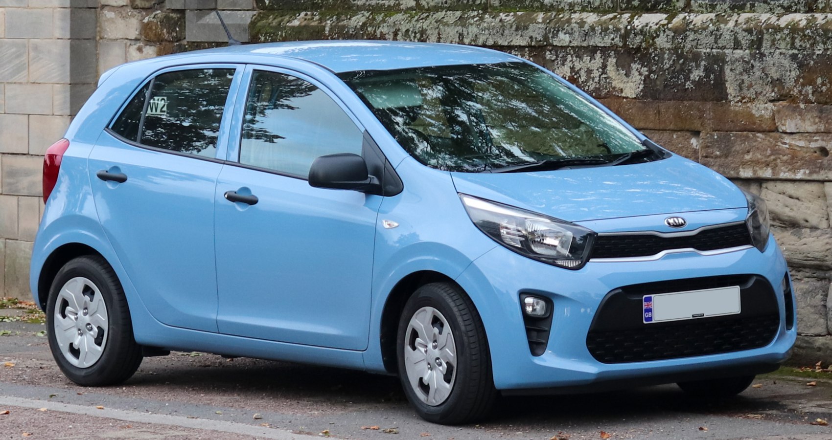 Blue compact hatchback with modern headlights and black grille